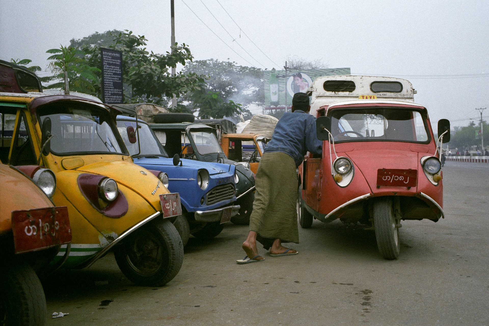 Old wooden buses dating back to colonial times and second hand 3-wheeled cars imported from China are just some of the aging modes of public transport the people of Burm have to rely on