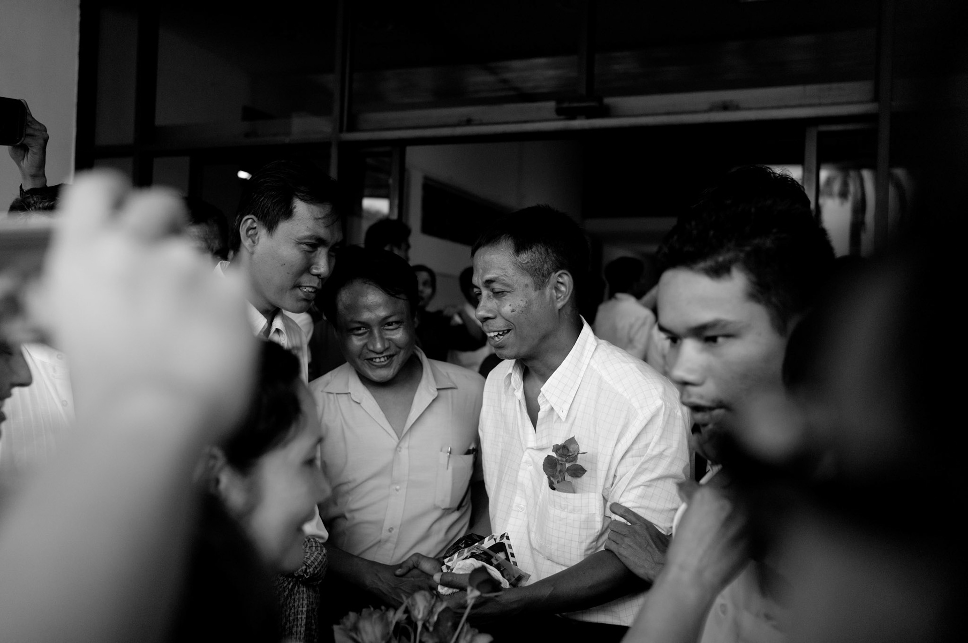 Friends and family rush to greet Zaya as he sets foot outside of Rangoon airport. The Presidential amnesty saw more than 600 political prisoners released from prison, many of who were former leaders of the mass democracy uprising in 1988 and were serving long sentences of 65 years or more.
