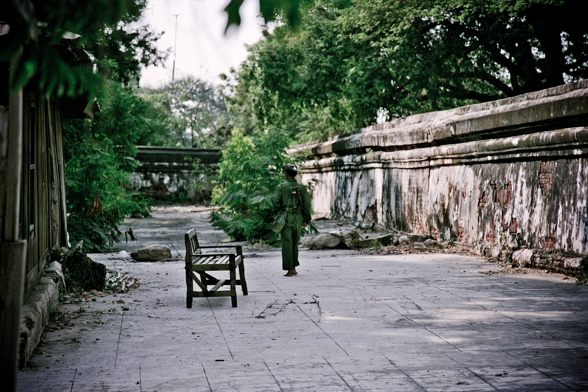 A Soldier from the Burmese army on patrol through a monastery in Central Burma.