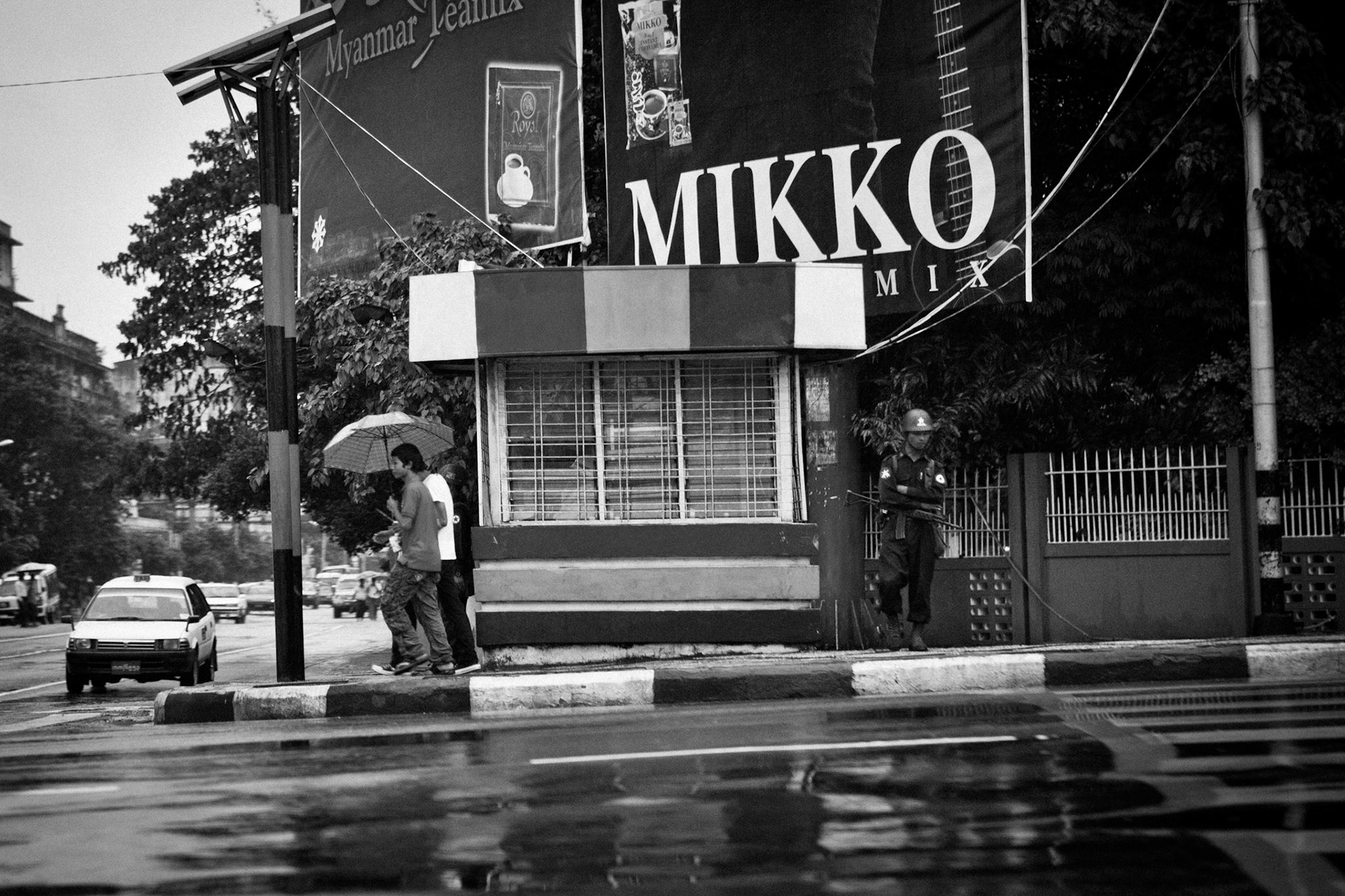 A soldier from the Burmese army stands on watch in downtown Rangoon