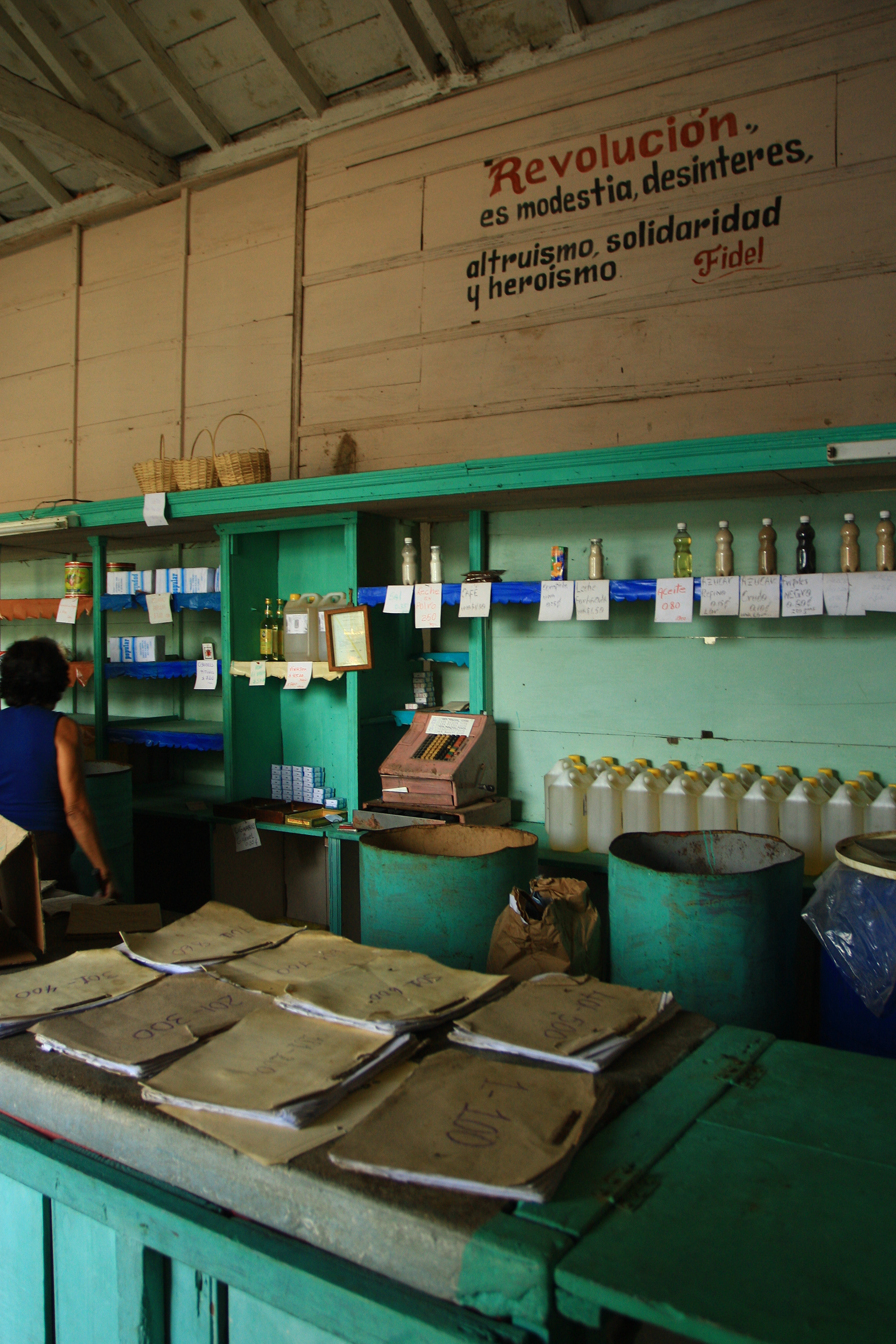 Ration shop, where locals can buy an allotted amount of necessities such as rice, sugar, matches, and cooking oil. Ration quantities per person are established by the government and tracked via a libreta de abastecimiento, or supplies booklet.
