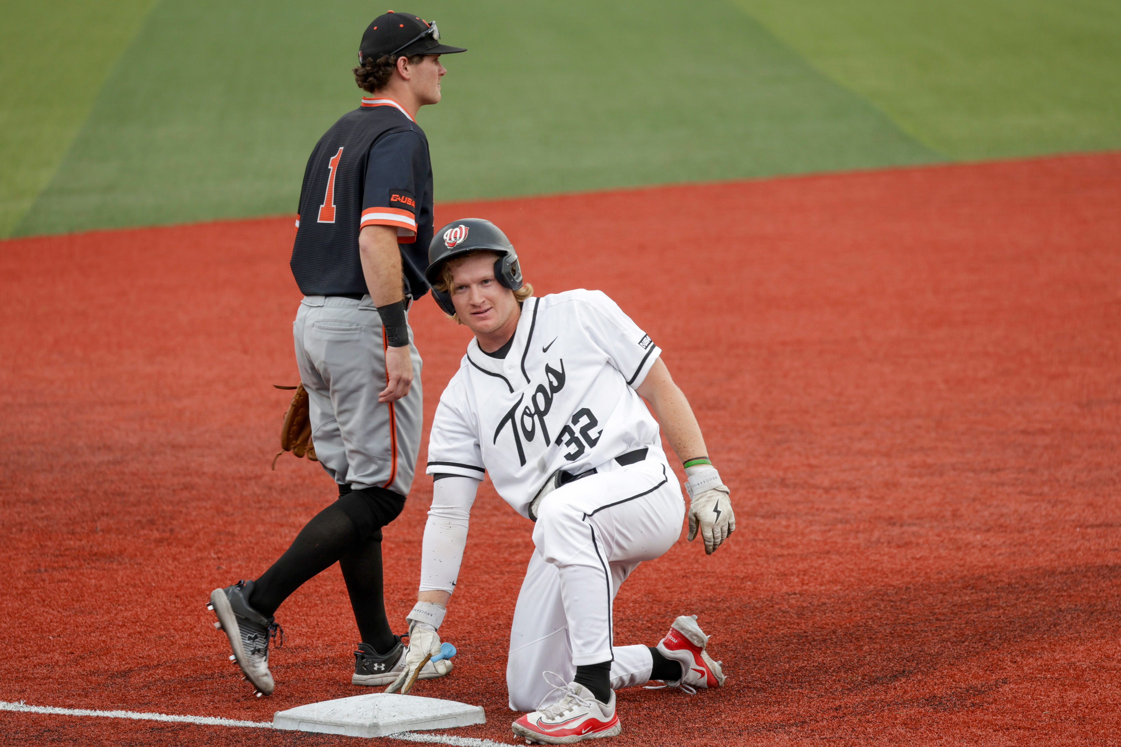 WKU outfielder Joe Siervo (32) reaches third base after hitting deep hit into the outfield against Sam Huston Bearkats on March 28 at Nick Denes Field. 