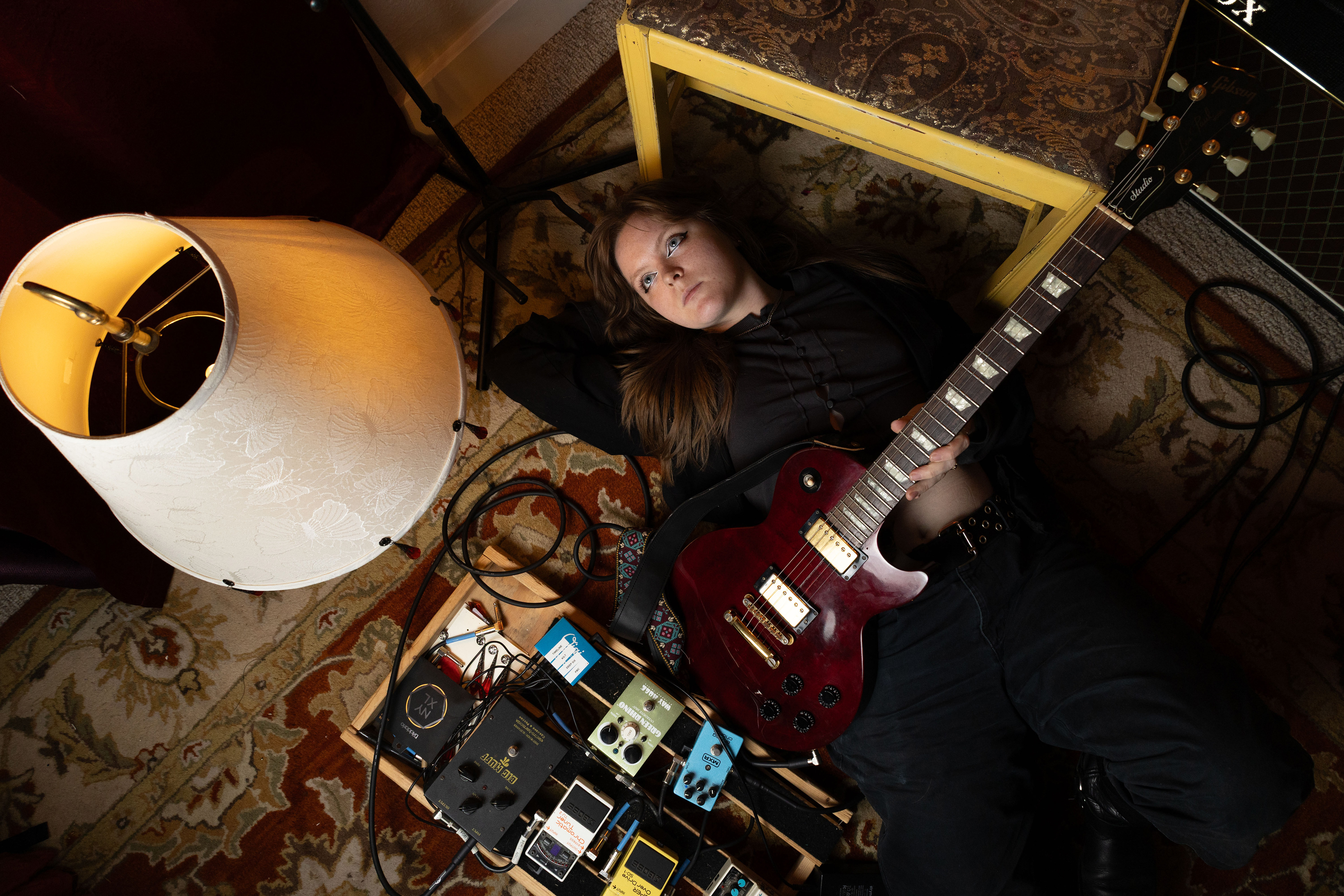 Ellie Sandlin is a singer, songwriter and poet from Bowling Green, Kentucky. She lays on the floor of her Bowling Green home on Wednesday, Feb. 11, 2026. 