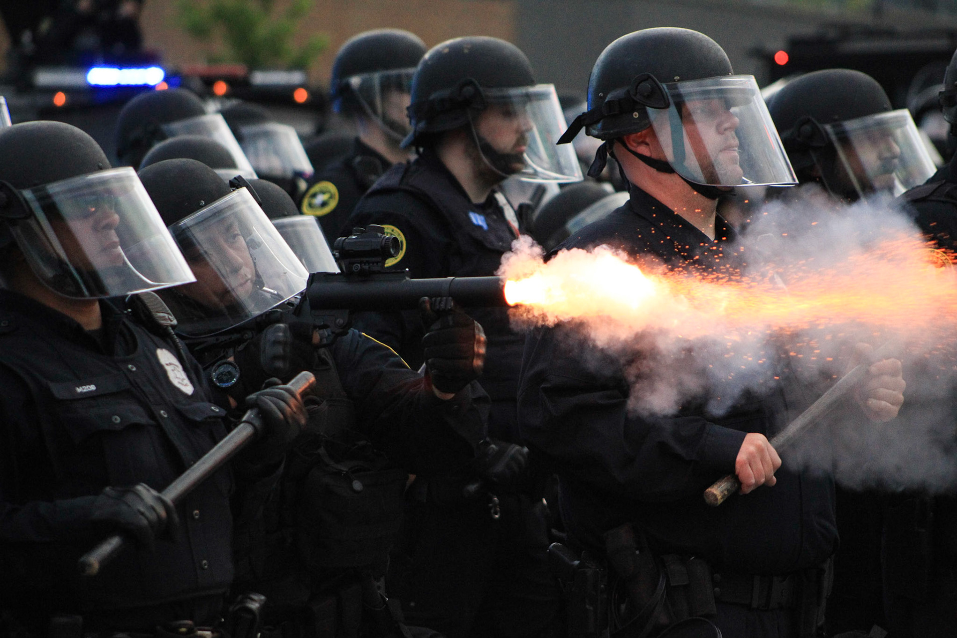 Milwaukee, WI, June 2, 2020.A march on the streets of Milwaukee Wisconsin, police shot down protesters. Police officers wrapped in a trail of smoke from teargas