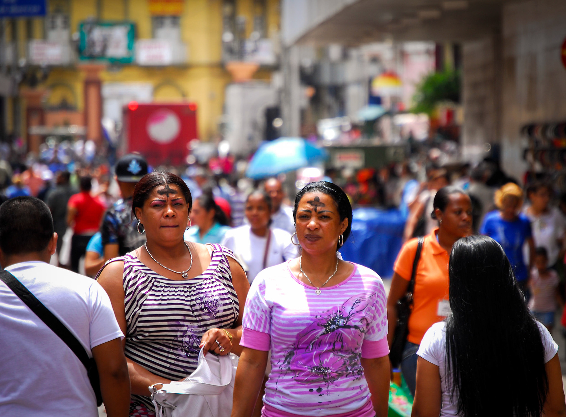 Panama City, Panama. 3/9/2011. The carnivals ended and like every good follower of the tradition of the Catholic Church, people walked in the streets after attending church with an ash cross on their foreheads. By: Edwin Gonzalez.
