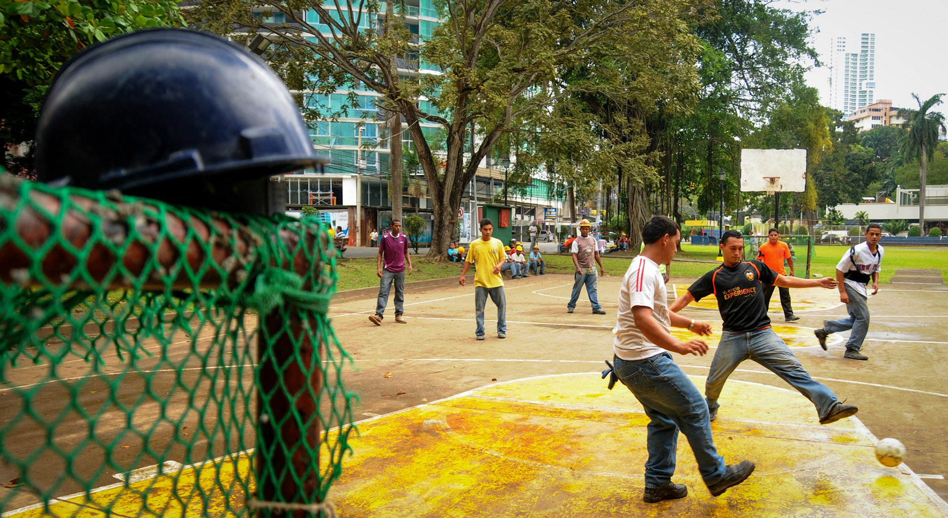 Panama City, Panama. Construction workers use their lunchtime to play soccer. It's time to drop their helmets and have fun before returning to hard work. By: Edwin Gonzalez.