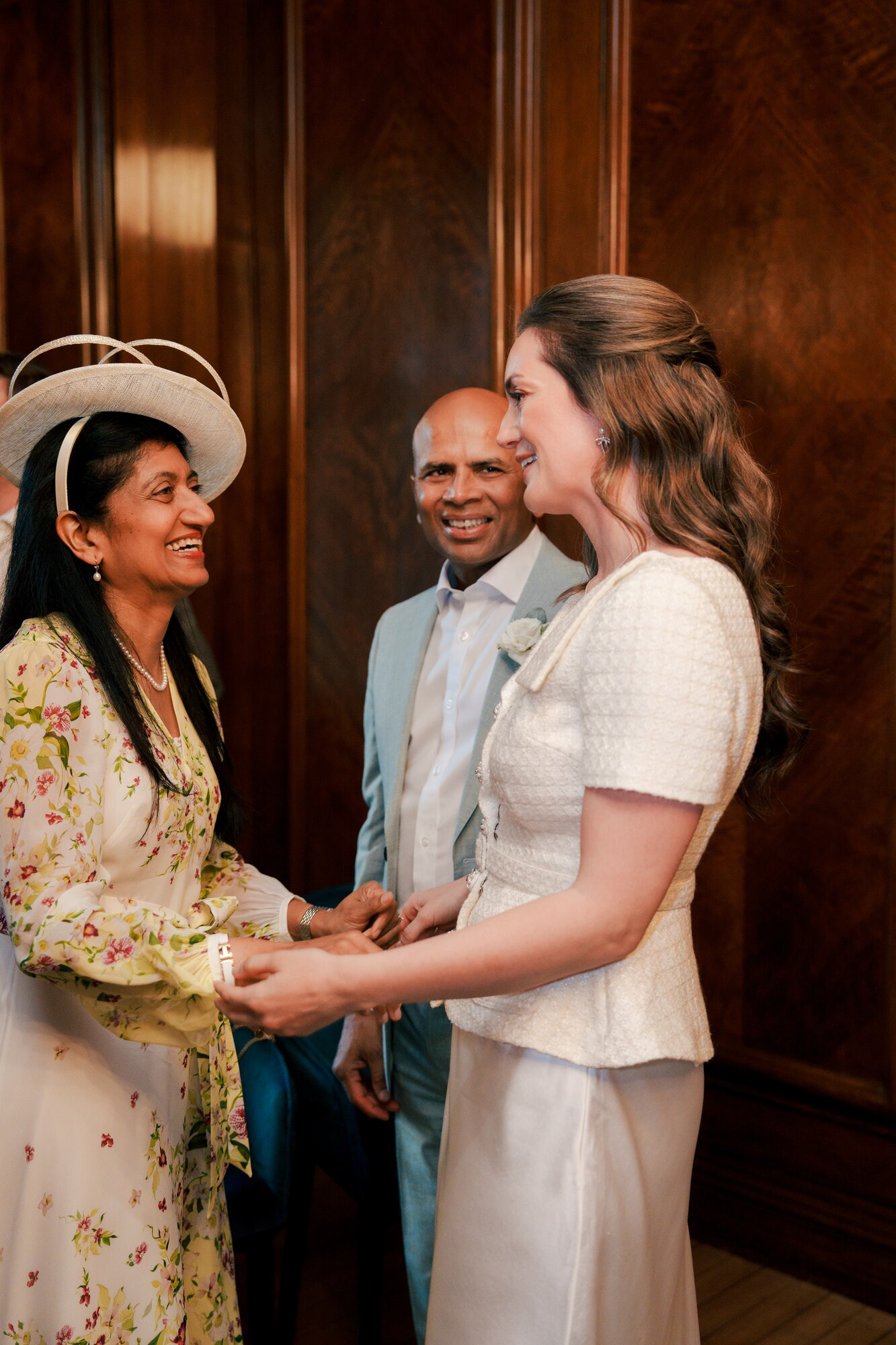 Bride greeting family with a smile after the ceremony in the Marylebone Room