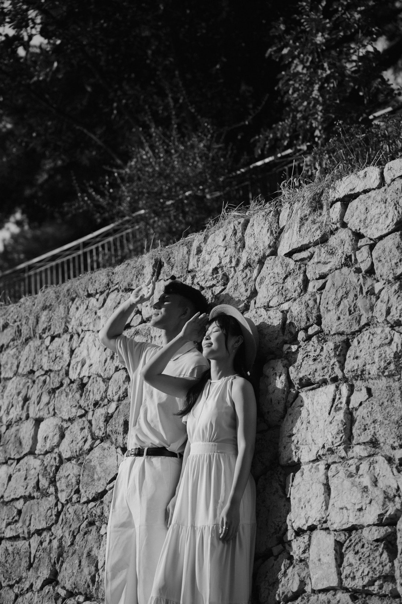 Black and white portrait against an old stone wall on Castle Hill