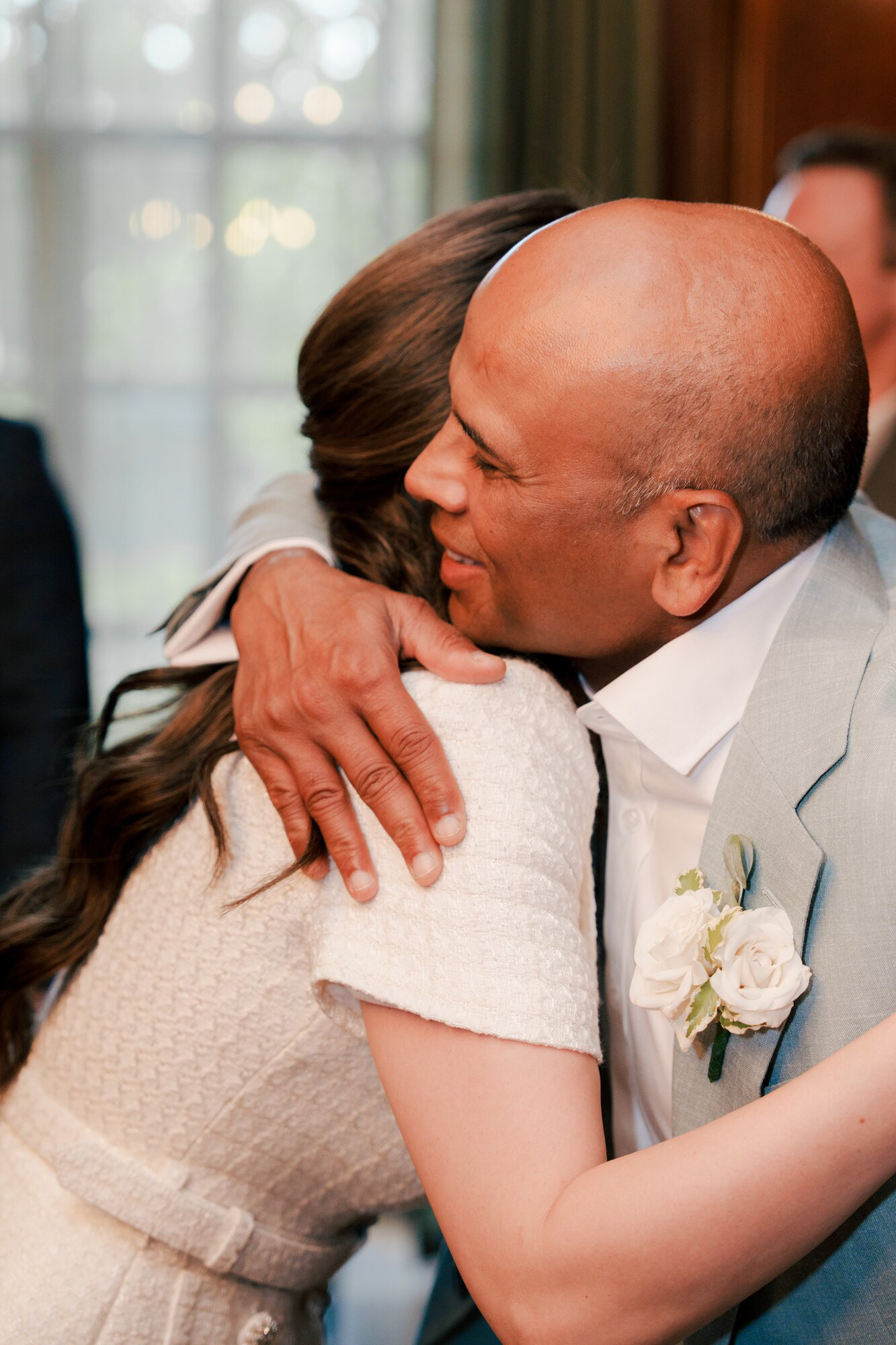 Bride hugging a family member after the wedding ceremony in London