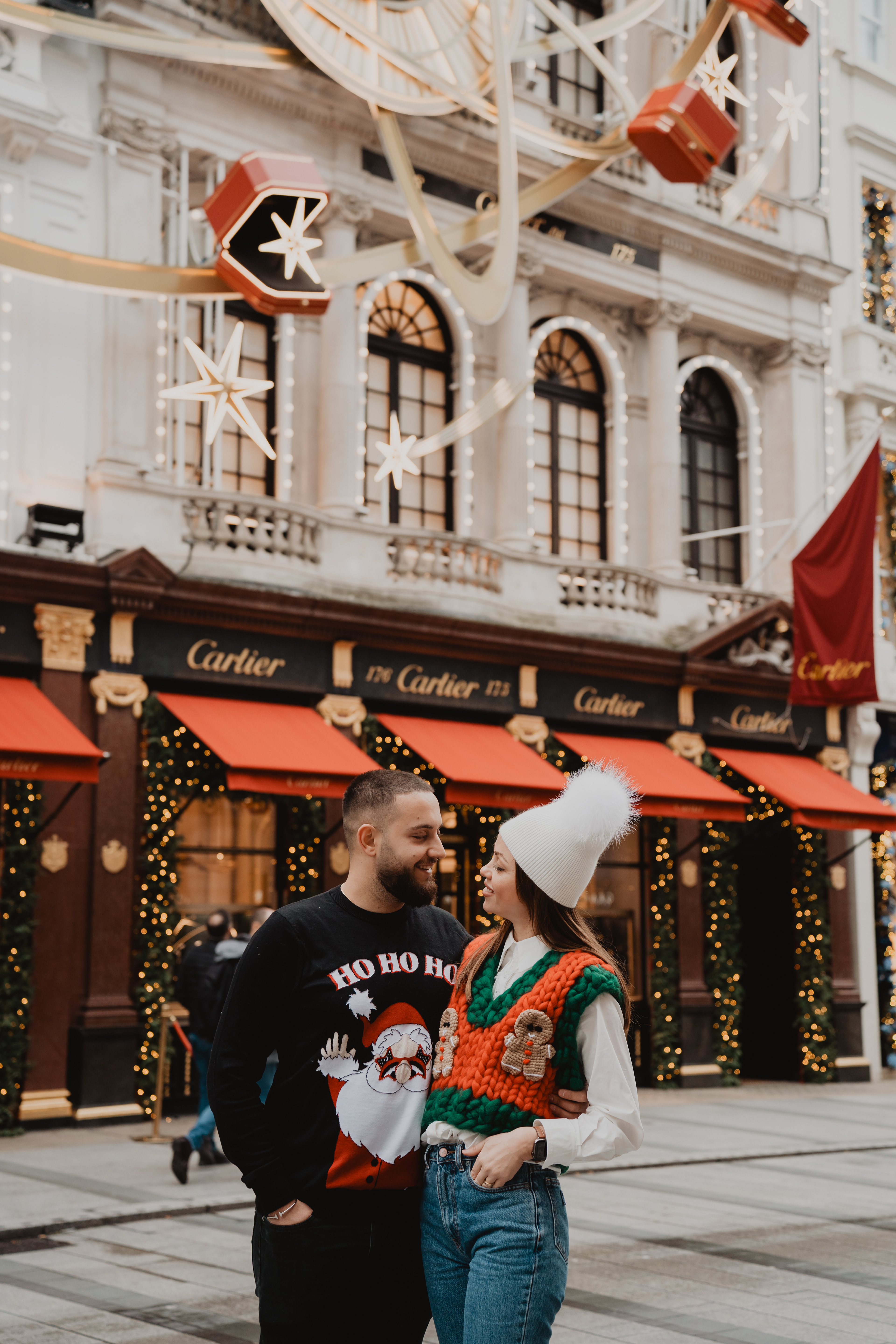 Couple portrait session under Christmas lights on Bond Street, London