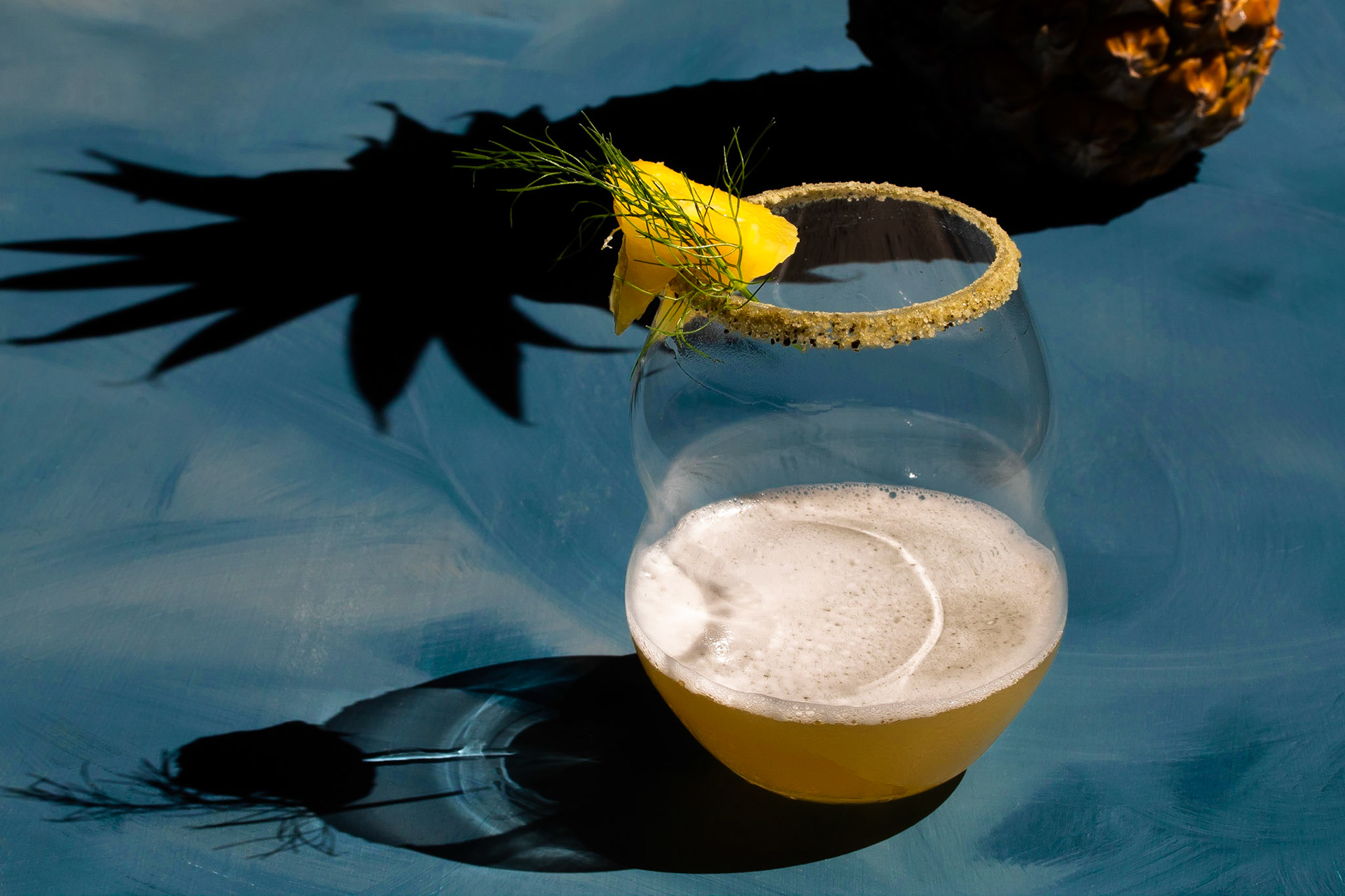 pineapple shrub margarita framed by shadows, menu development project