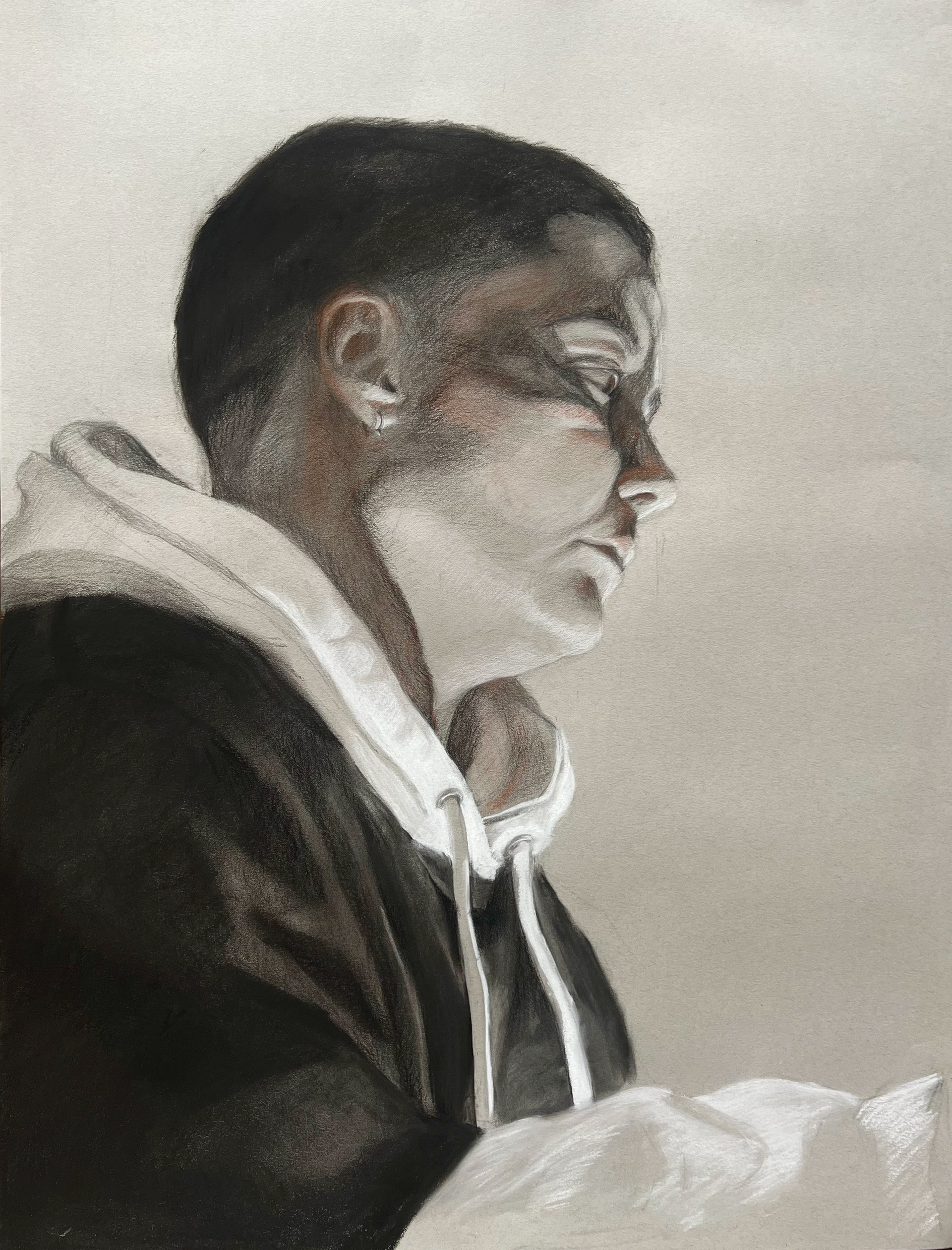 Self portrait profile using two mirrors, 2025, conte and charcoal on toned paper, 19" x 25"