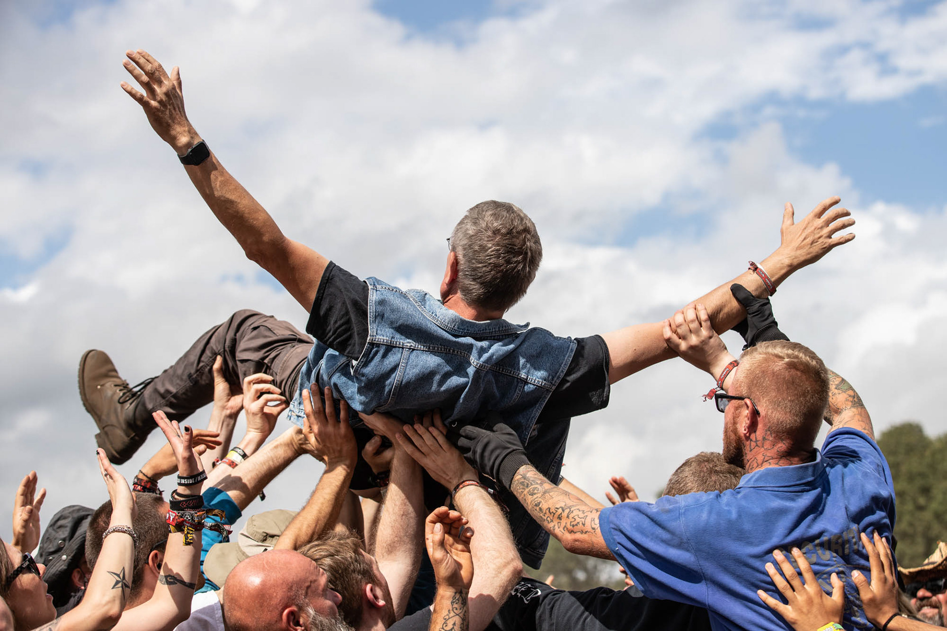 Metalheads at Wacken Open Air 2022, Crowdsurfing
