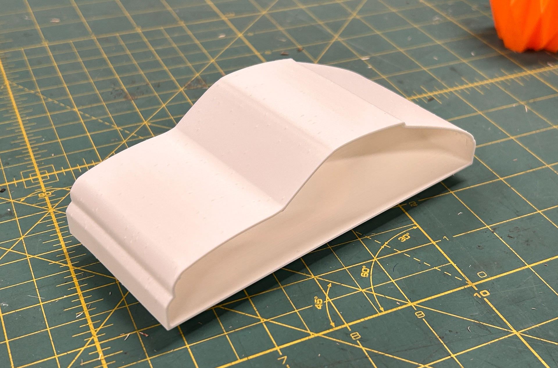 3D-printed Porsche body sample for design engineering challenge.
