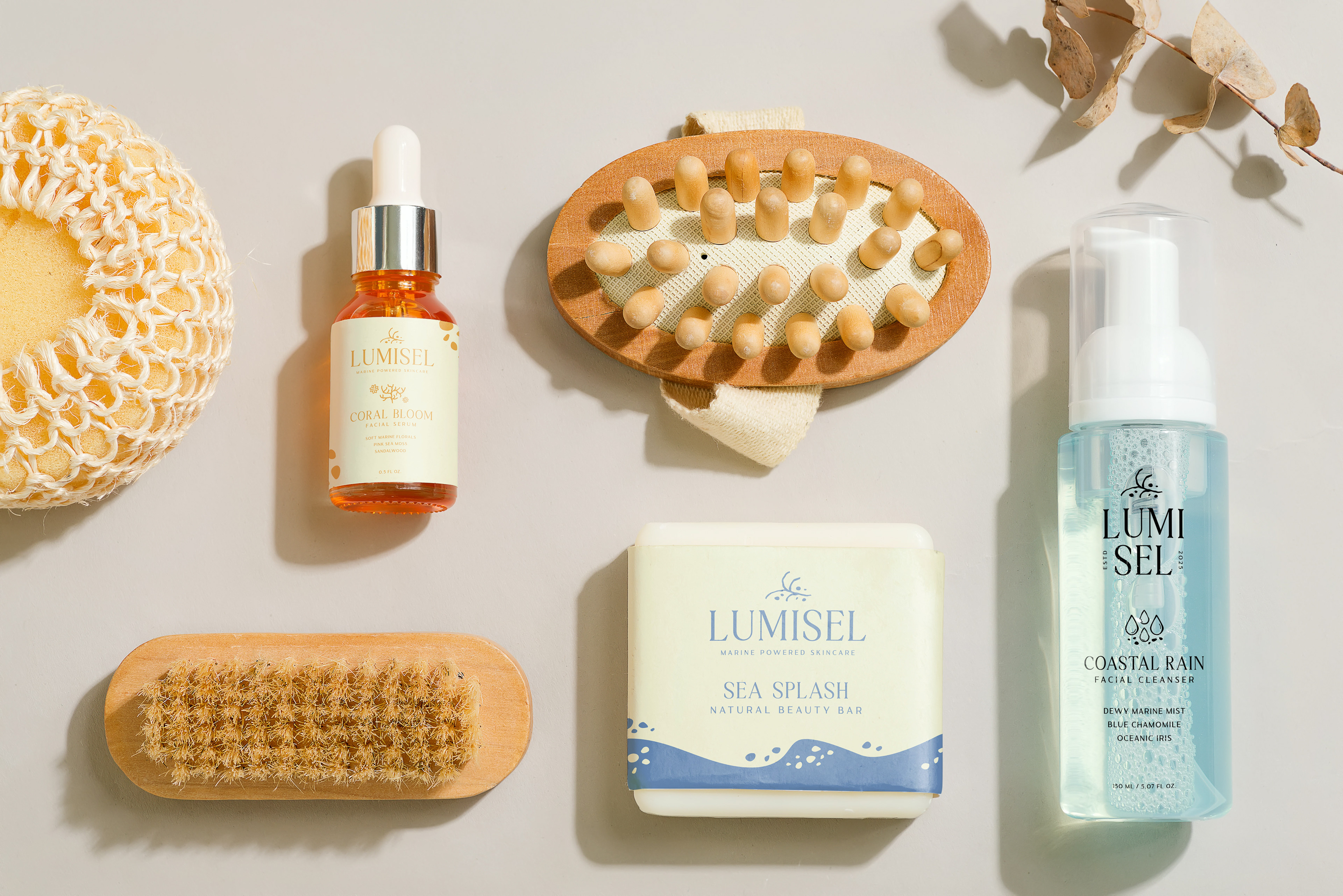 Lumisel Skincare packaging including beauty bar, facial serum, and facial cleanser that depict cohesive branding of the natural marine beauty brand