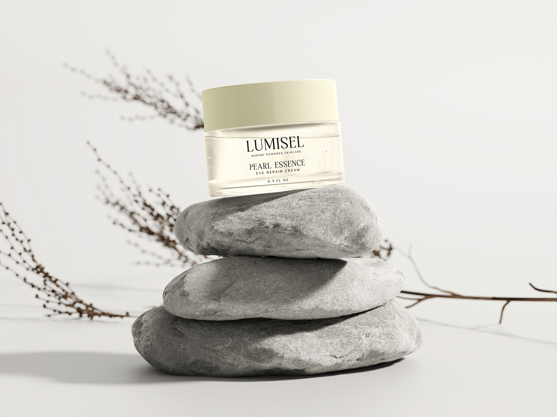 Pearl Essence Eye Cream on top of three pebbles t