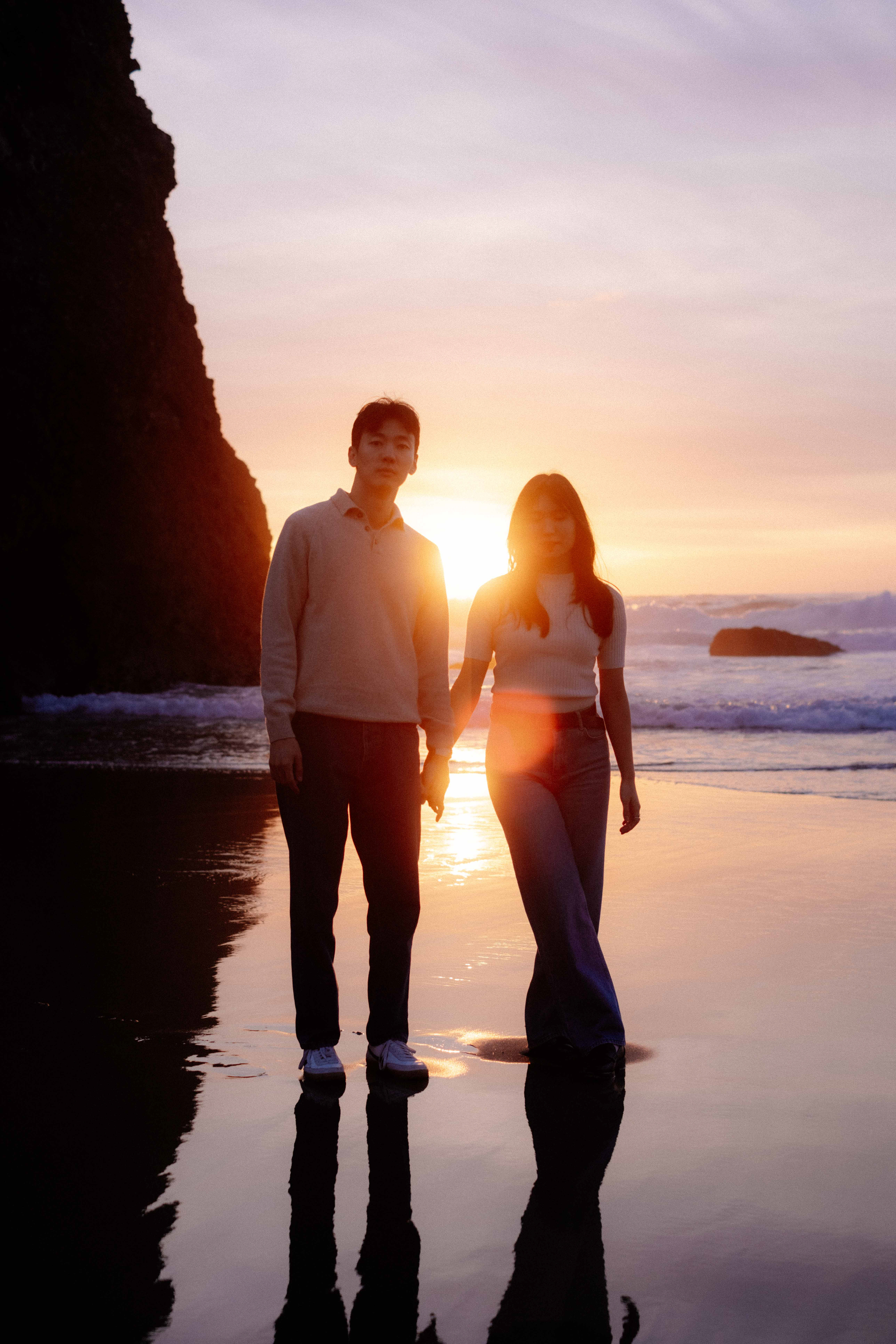 Couple posing on a beach at sunset, Portugal