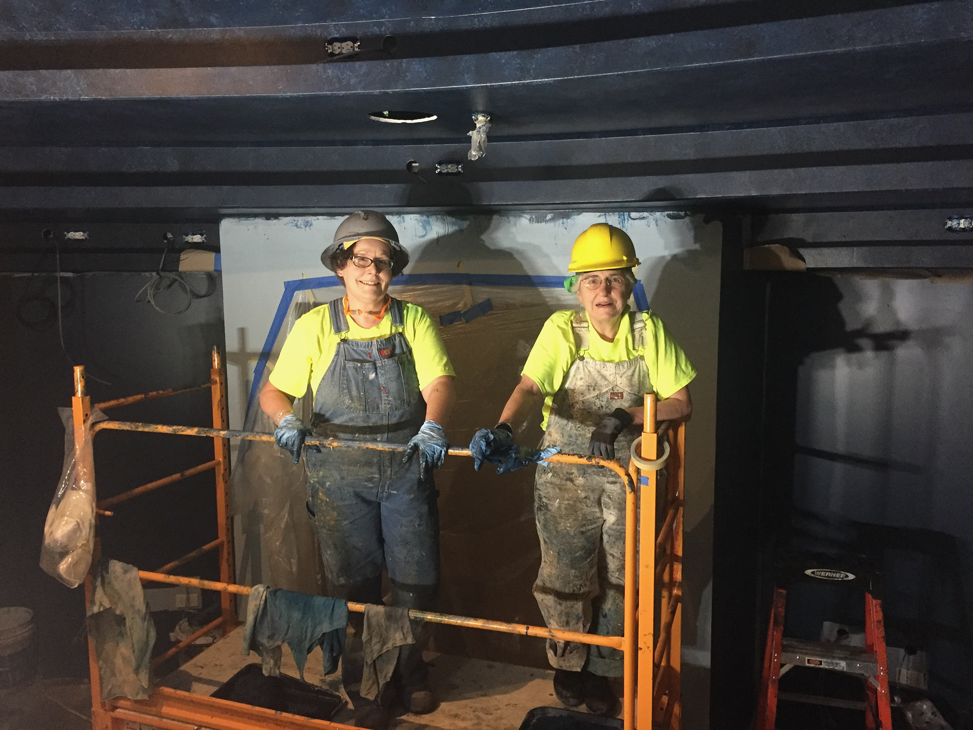 Onboard ship painters pausing.