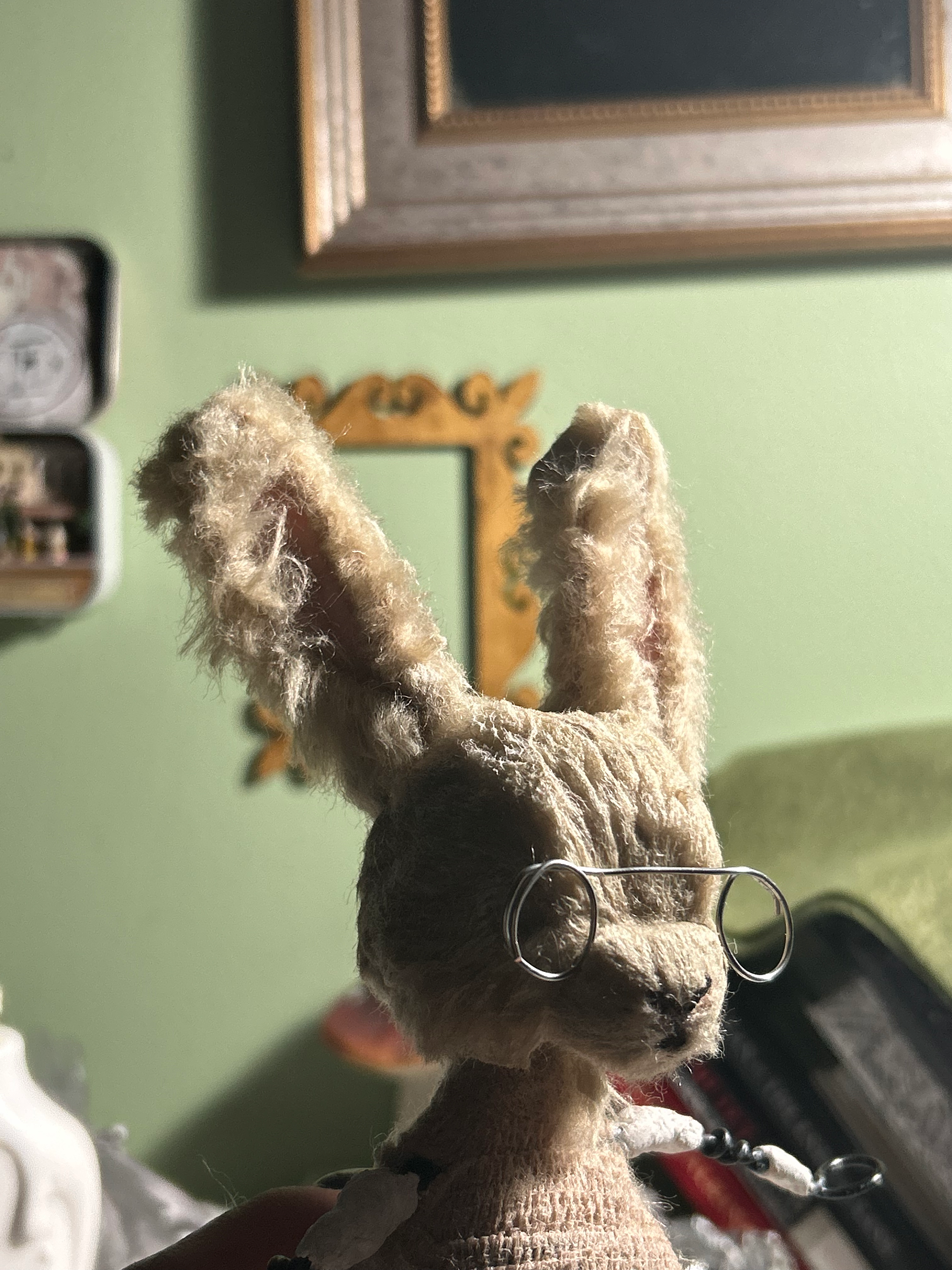 I dyed white polyester fur to the desired color and combed liquid latex through it to shape it. Ears were made with thin armature wire, felt and more of the fur