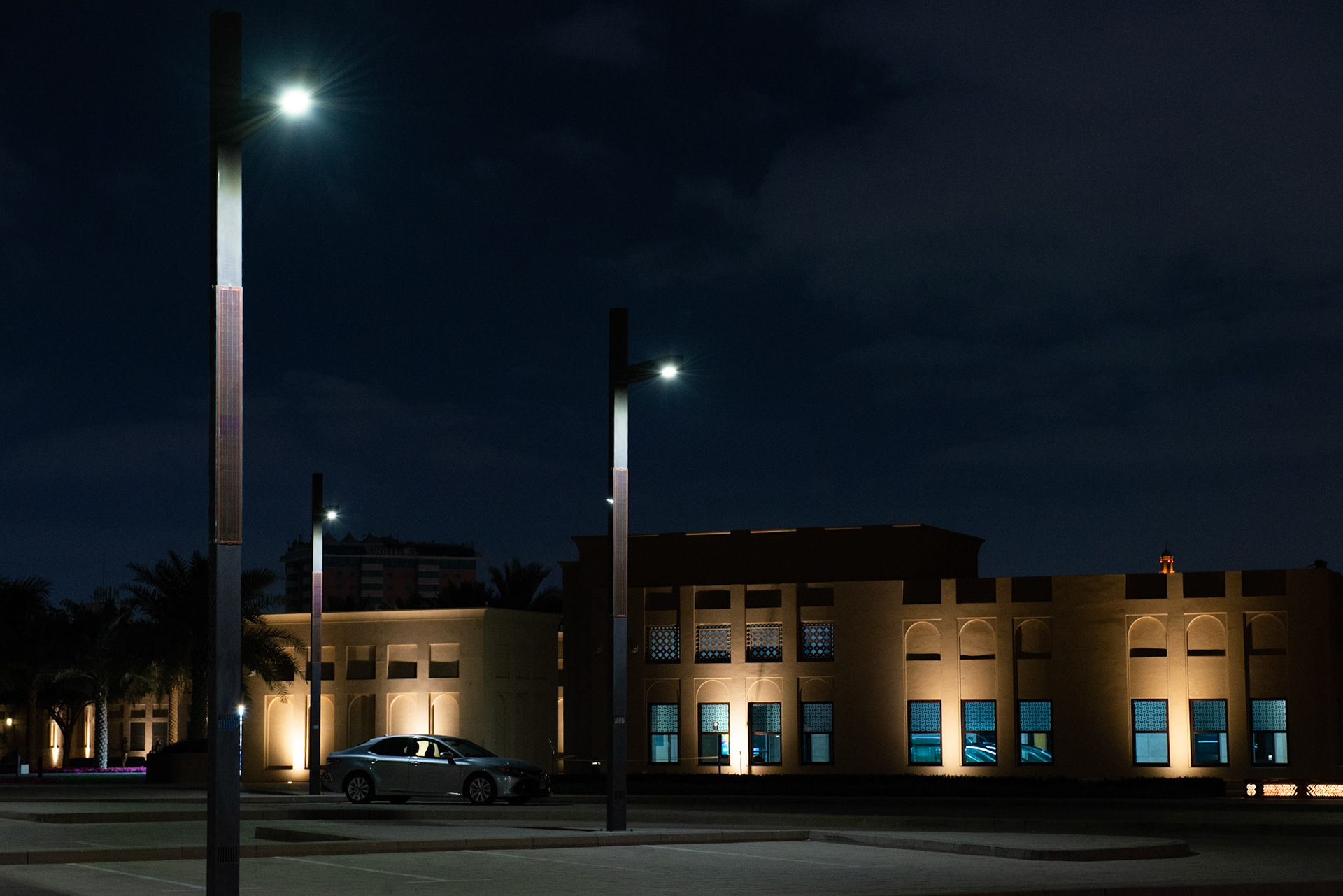 Parking lot by night with a lonely car in Al Fahidi district in Dubai, UAE