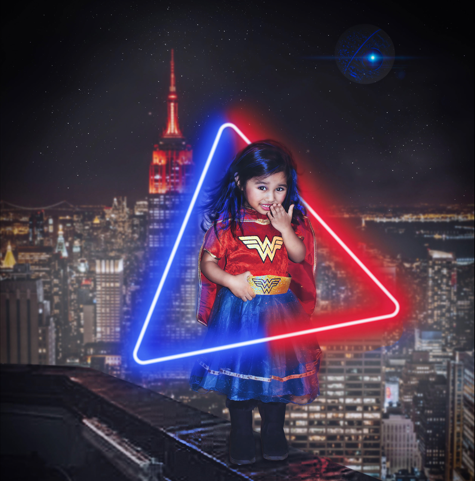 Little Wonder Woman Standing tall against the city skyline, Khaliezy shines as Wonder Woman. The neon glow highlights her bravery, playfulness, and superhero spirit.
