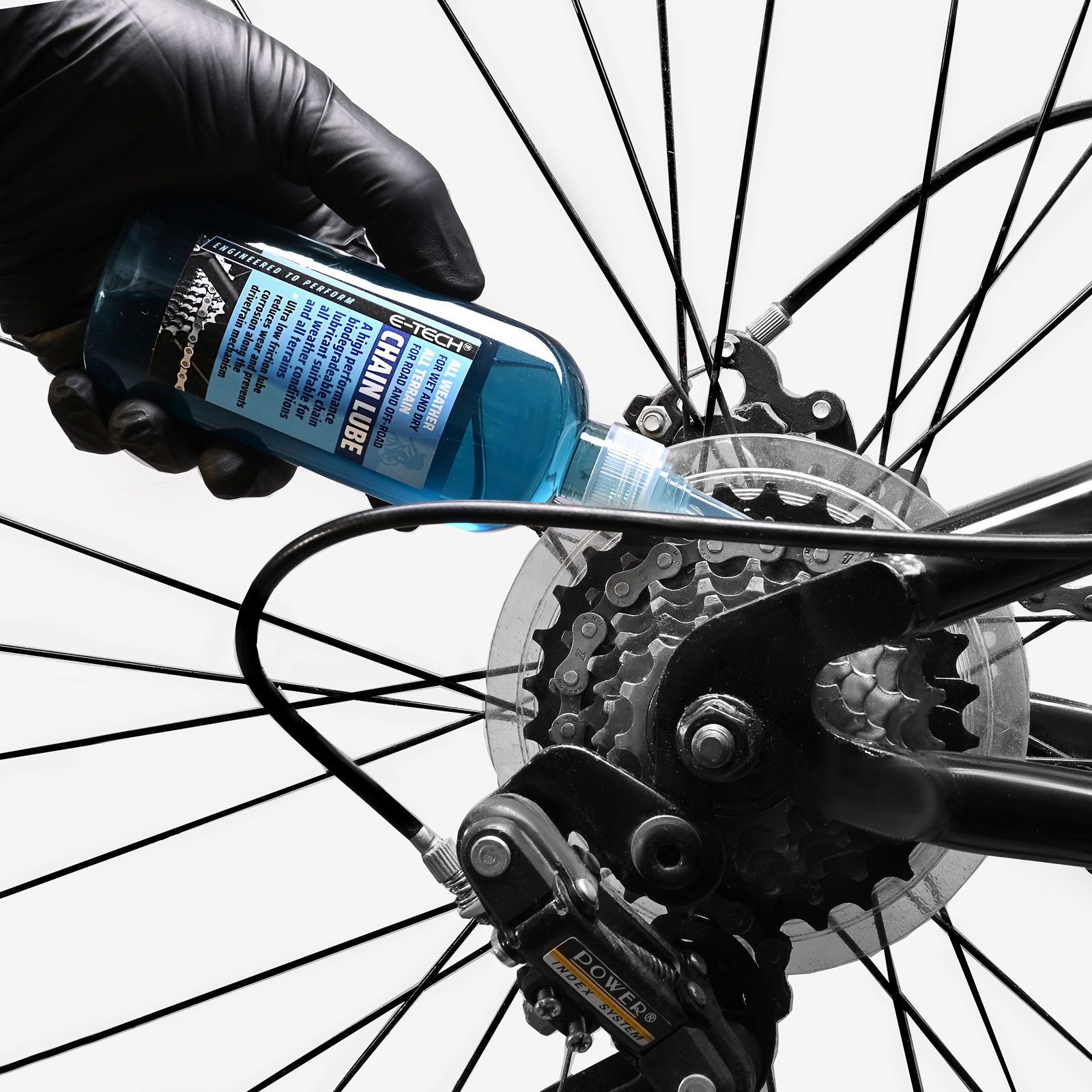 bycycle chain lube being applied to chain in lifestyle photo | product photography | Pro Exposure Photography