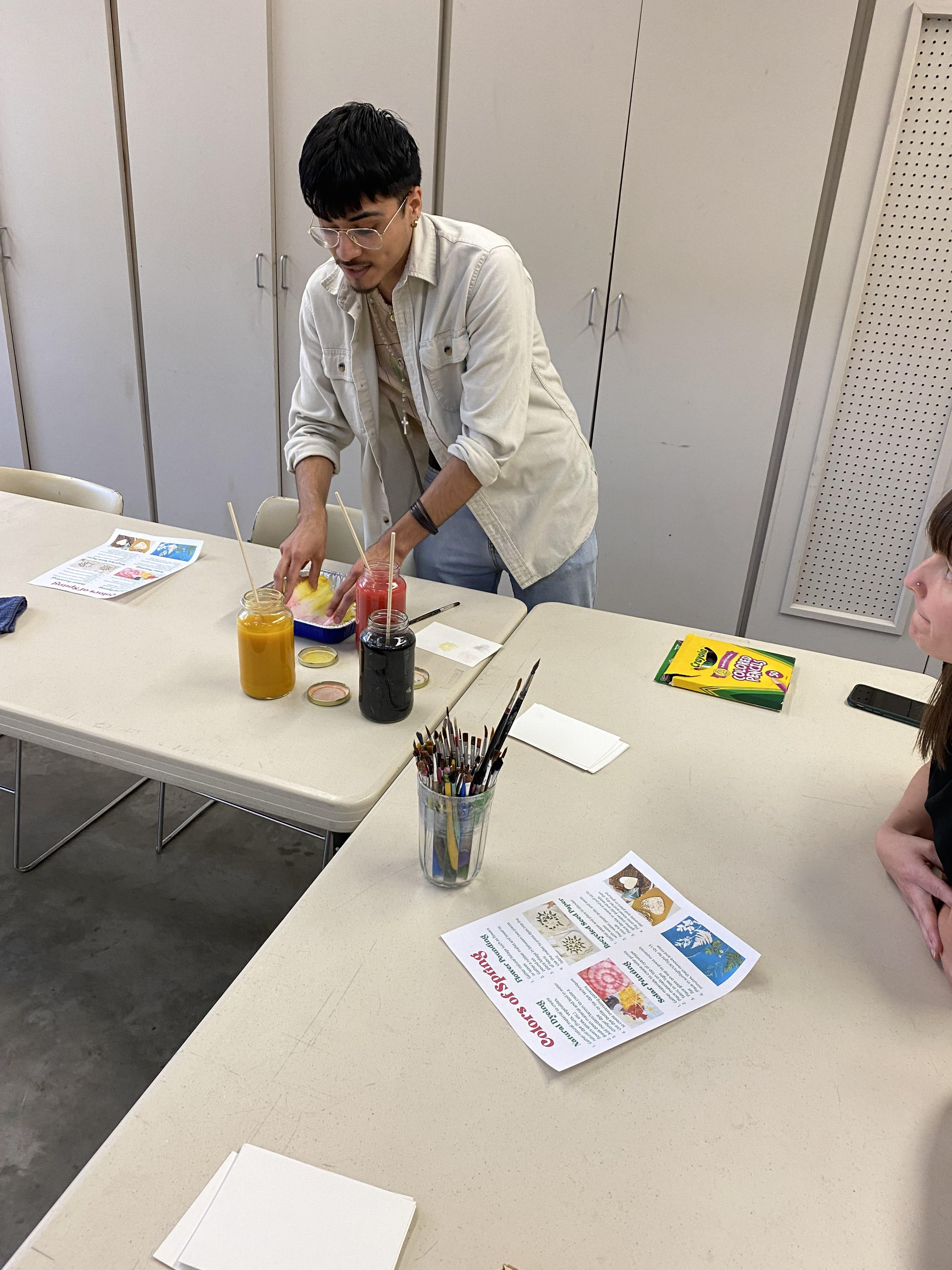 Student Jonathan DeLaCruz demonstrating dying process