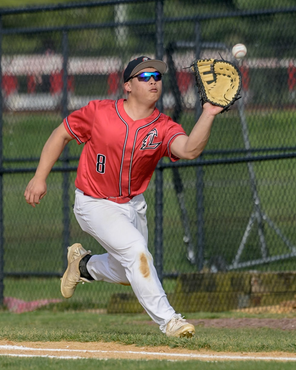Alex Vuong of Lenape High School fields a pop fly during the game against Rancocas Valley at Lenape High School in Medford, NJ. (Photo by Brian Barbash/gametimedreams.com)