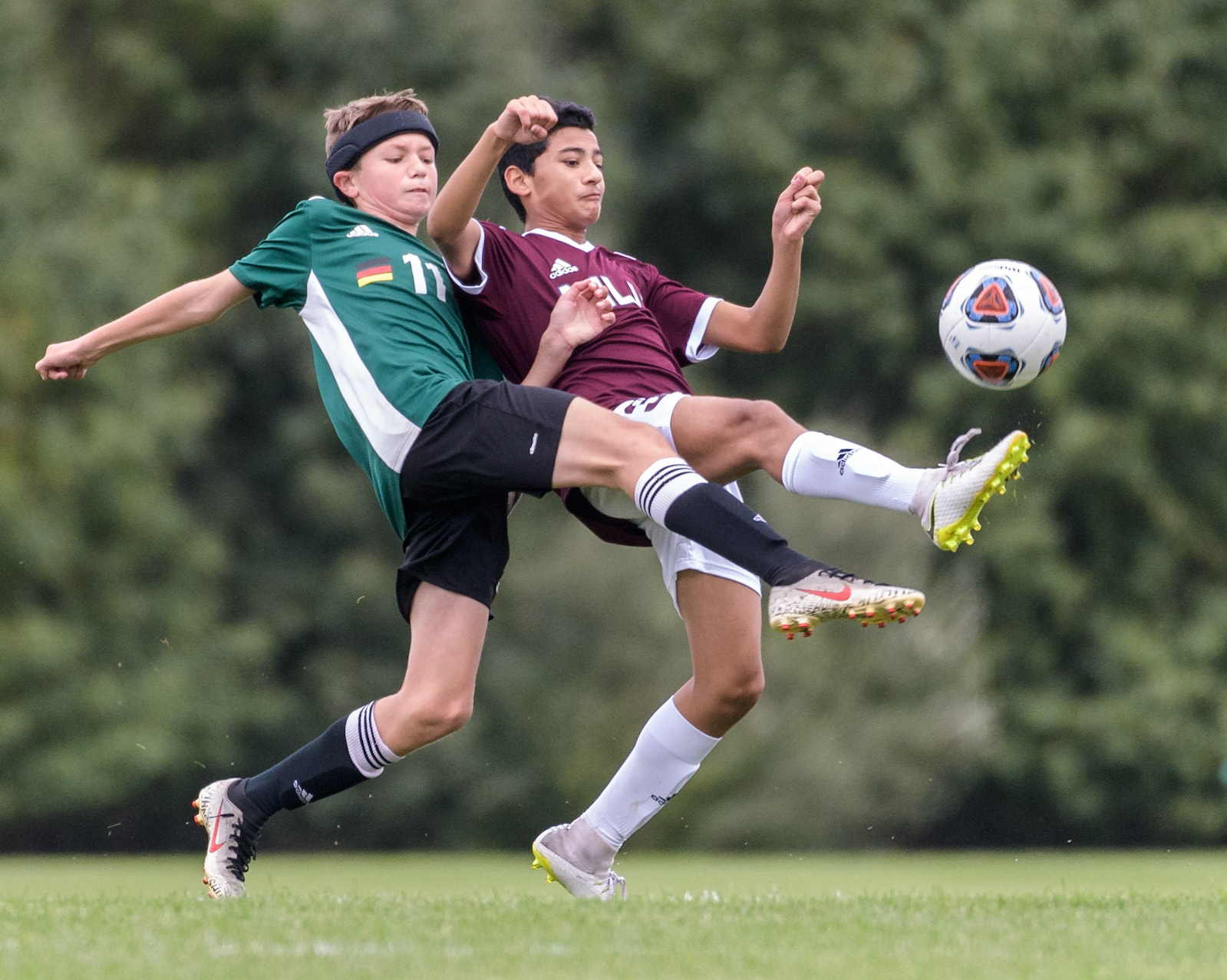 Sahil of Mount Laurel United fights for the ball against Danubia Hot Spur.
