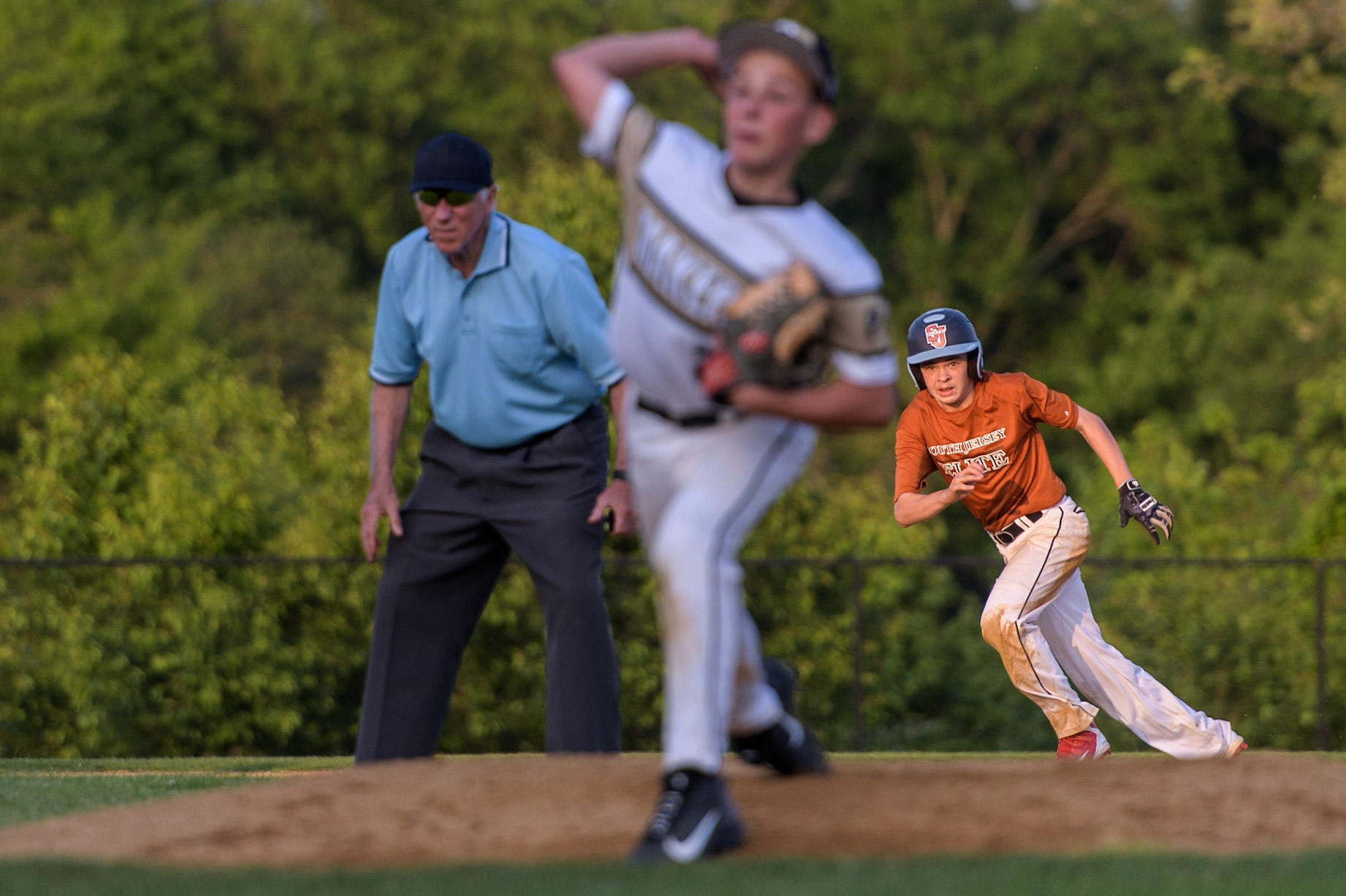 Zach of South Jersey Elite makes his move towards third against the PA Playmakers.