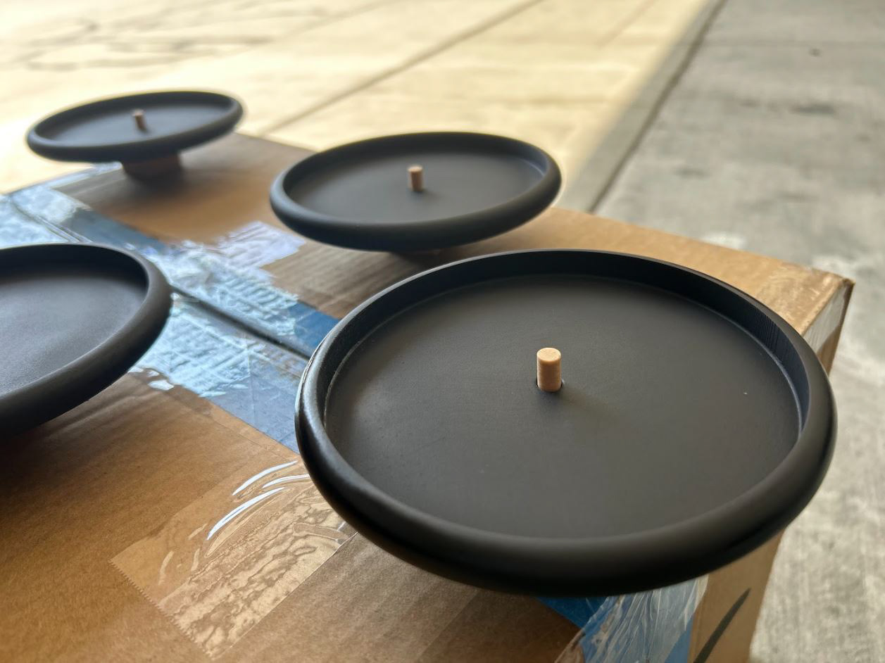 Tag Display Disks on a jig piece, drying after a matte coating