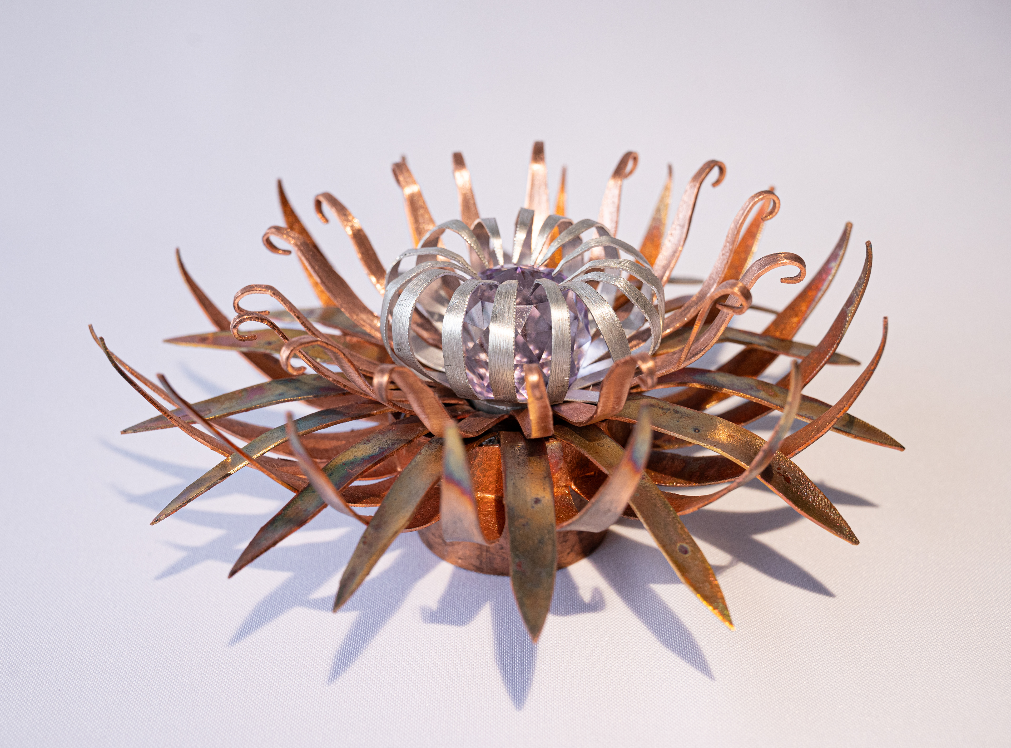 "Purple Heart Anemone", side view, copper and aluminum with glass crystal, 7 diameter  x 3 high, $125