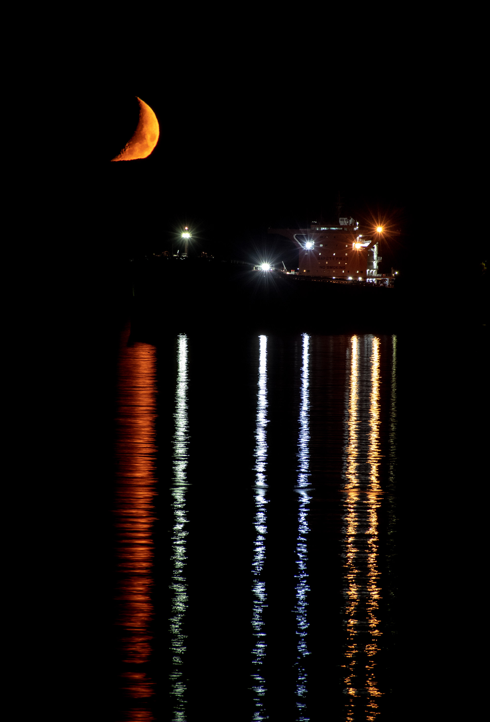 Crescent moon showing this freighter how it's done on the Saalish Sea.