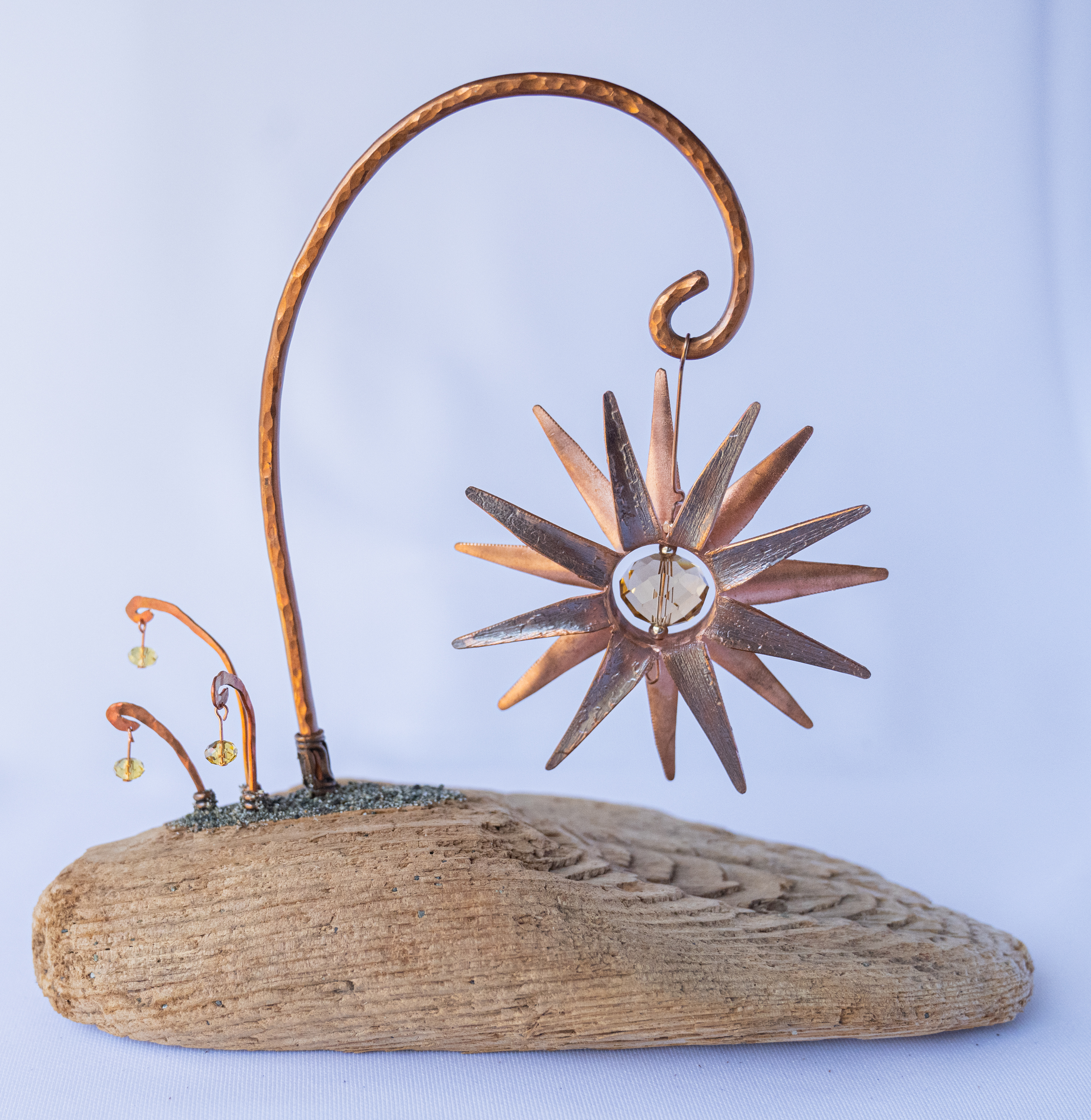 Star Struck II, 4.5w x 8w x 7.25h, copper flower with crystal centre on Vancouver Island driftwood, $75