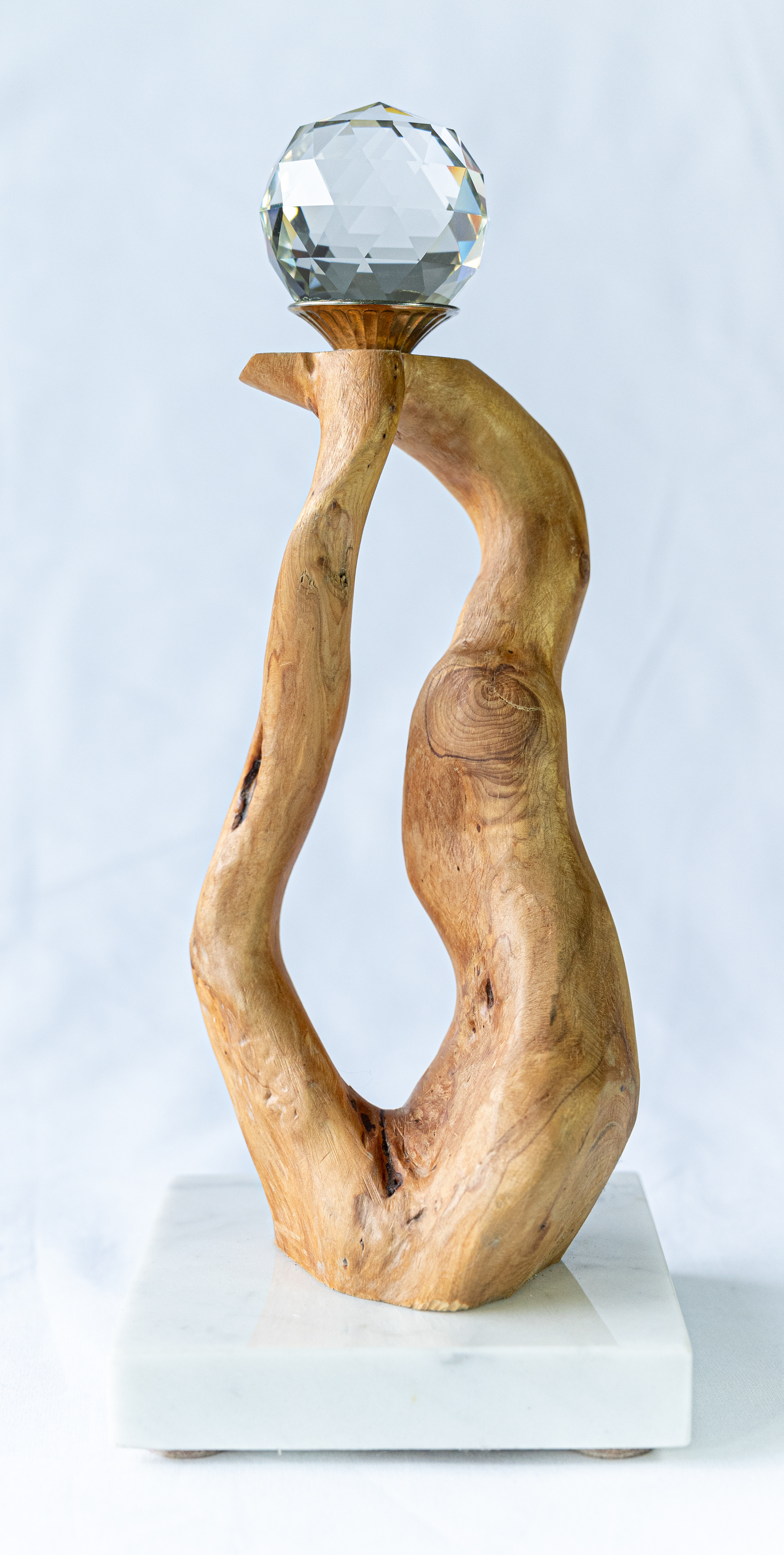 "The Gift" features reclaimed Yew wood from Vancouver Island in its natural form, just cut to size, sanded and attached to a marble base then topped with a 2" crystal, 4 inches wide x 4 inches deep x 11 inches high $125