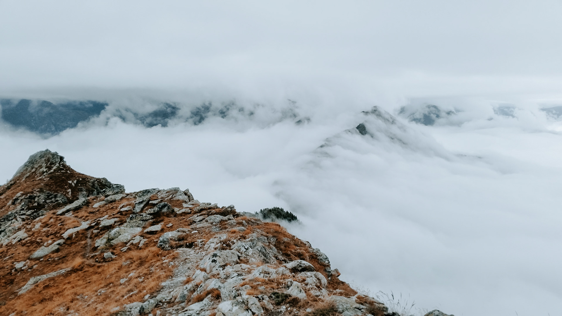 Clouds floating over a ridge in Aosta Valley