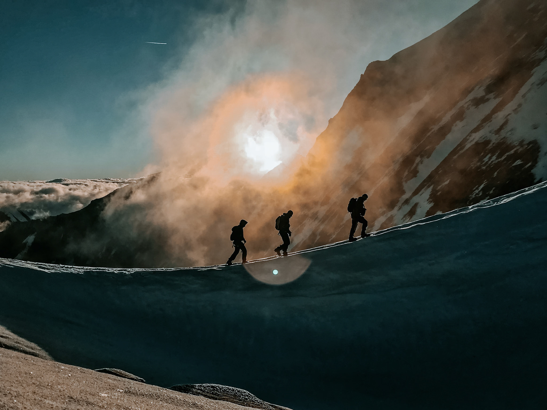 Three mountaineers on the Kaindlgrat