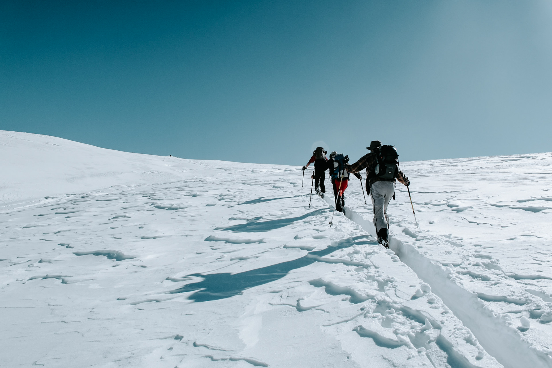 Skiers going uphill in Valle Maira