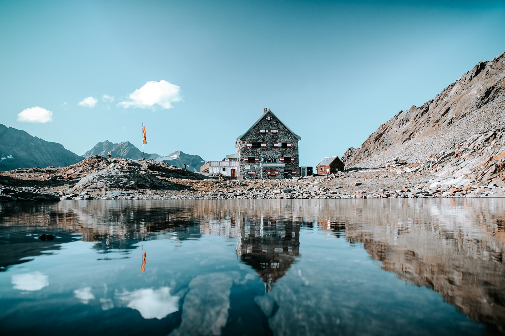 The Hochwildehaus is reflected in a mountain lake