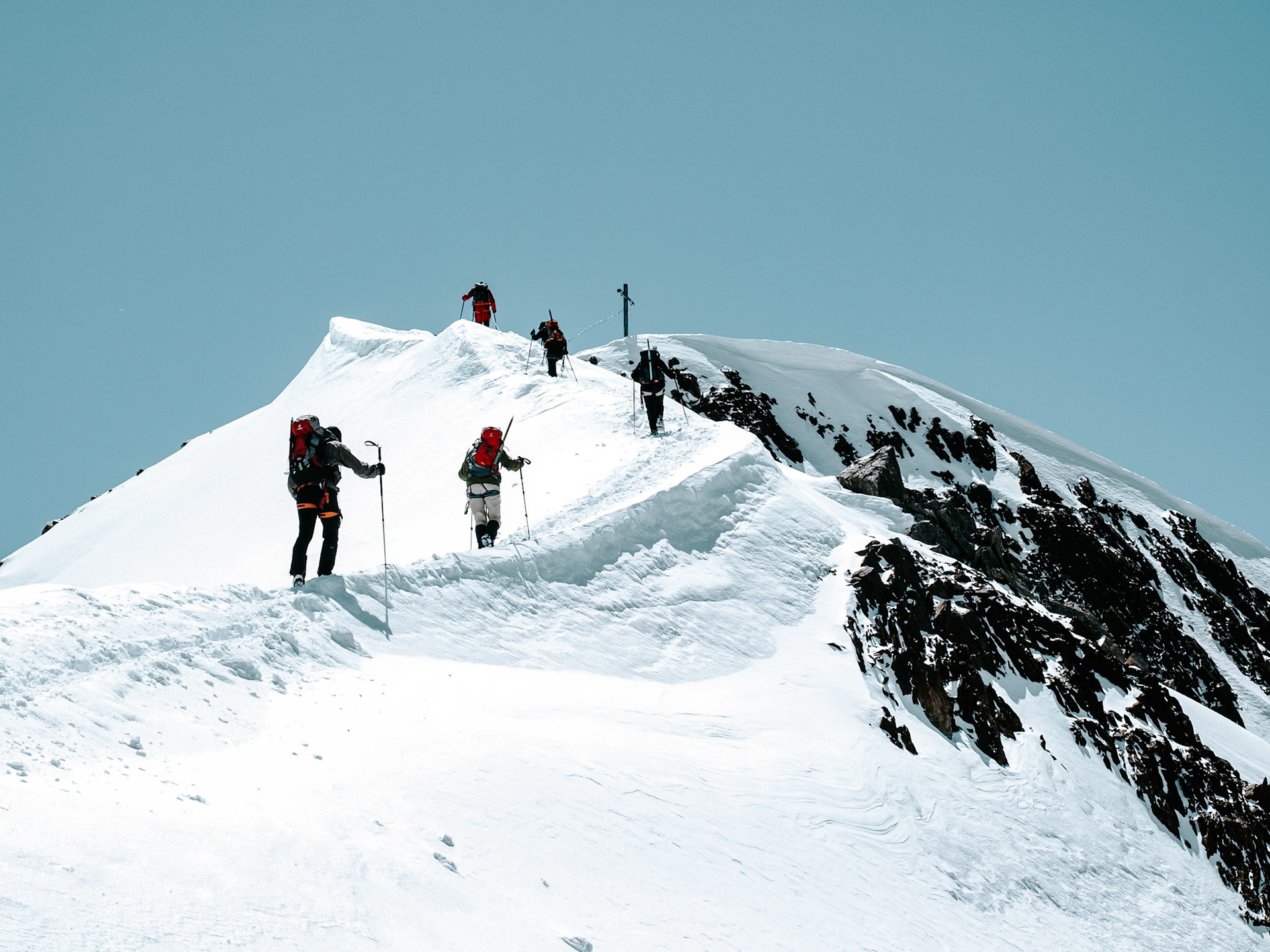 Mountaineers on the last meters to the summit of Similaun