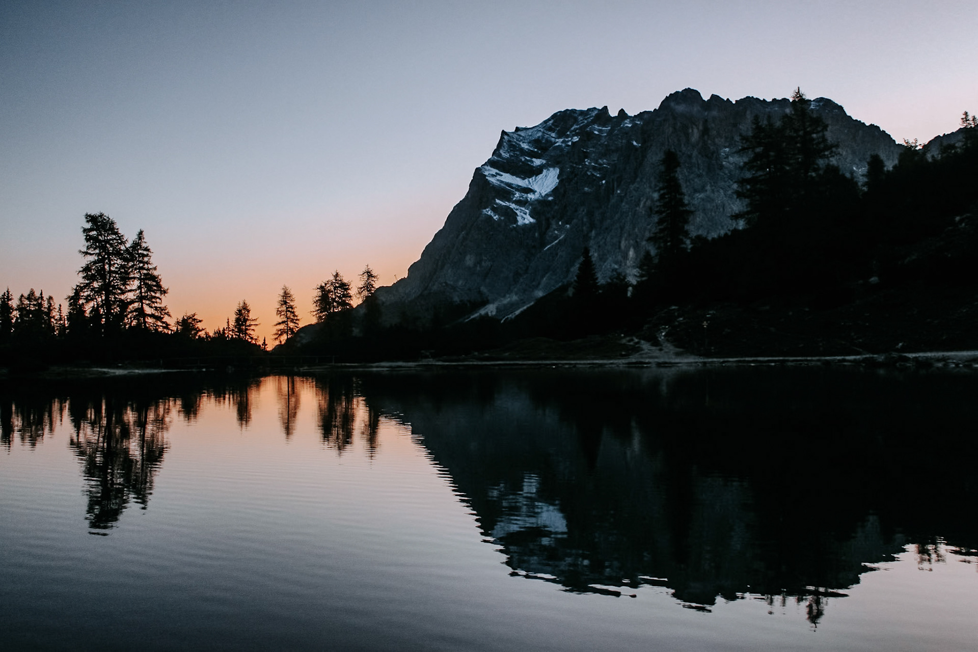 The Zugspitze is reflected in the Seebensee in the morning light