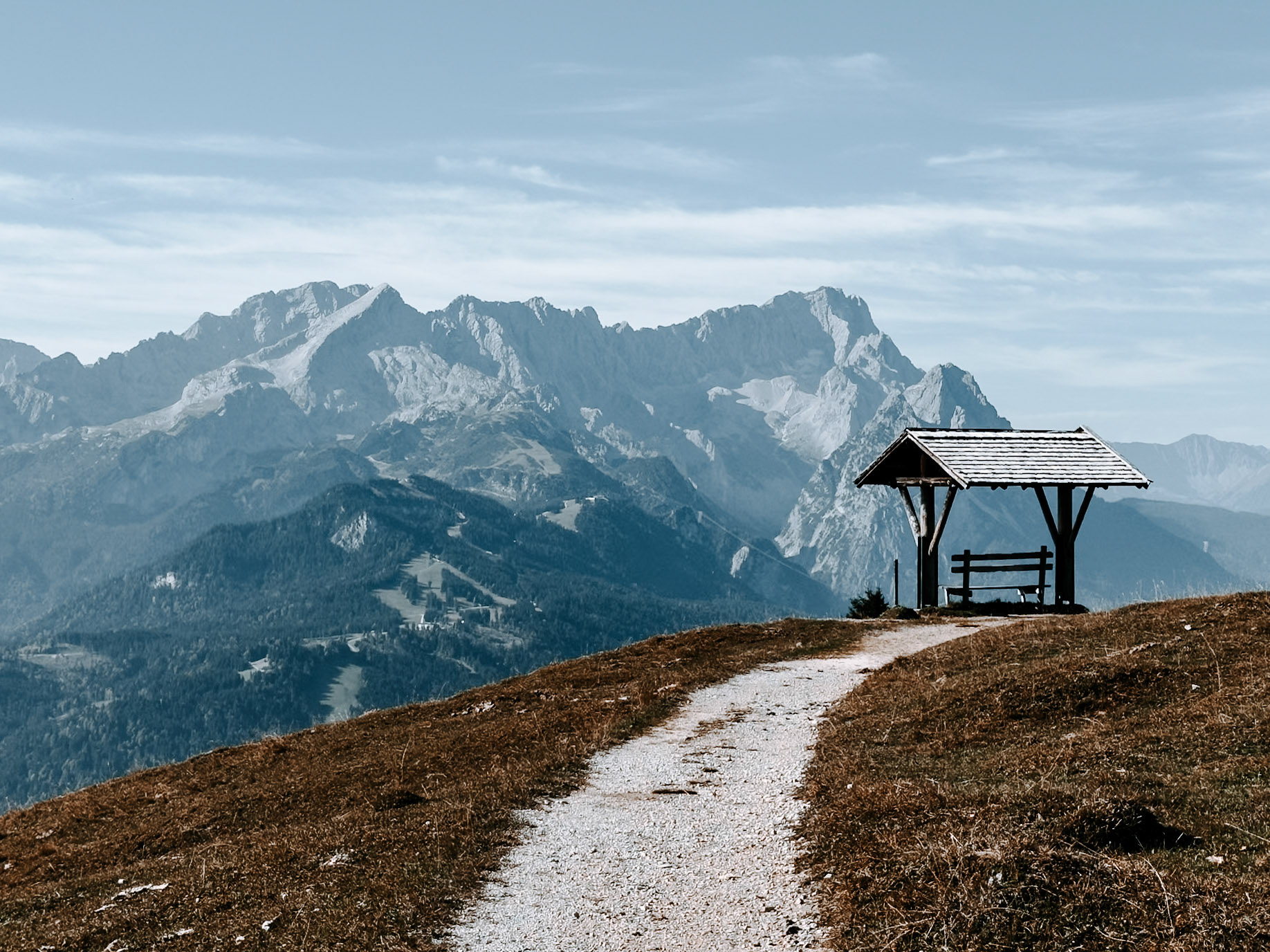 Viewing bench on the Wank with a view of the Zugspitze (far)
