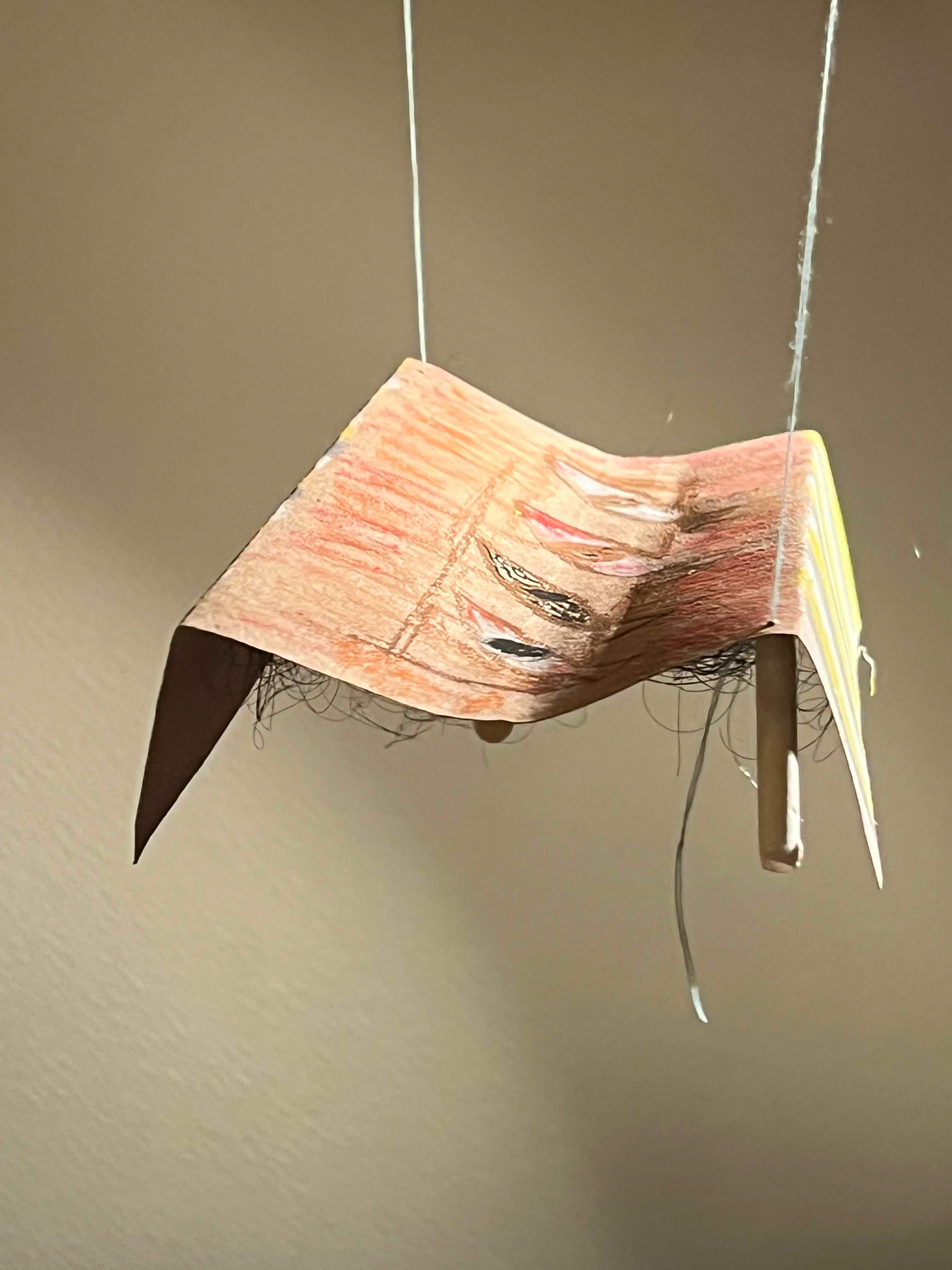 a floating table held up by threads