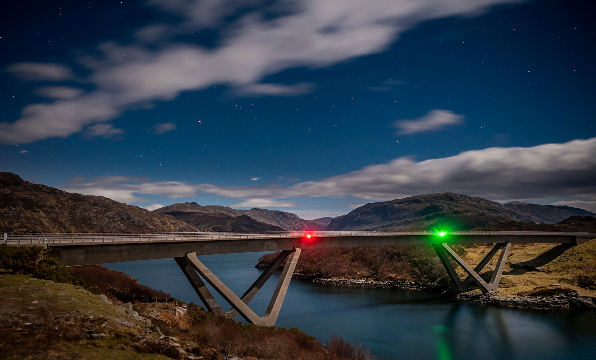 The Kylesku Bridge, in Scotland's far northwest.  Only at night will its navigation lights winky at you.