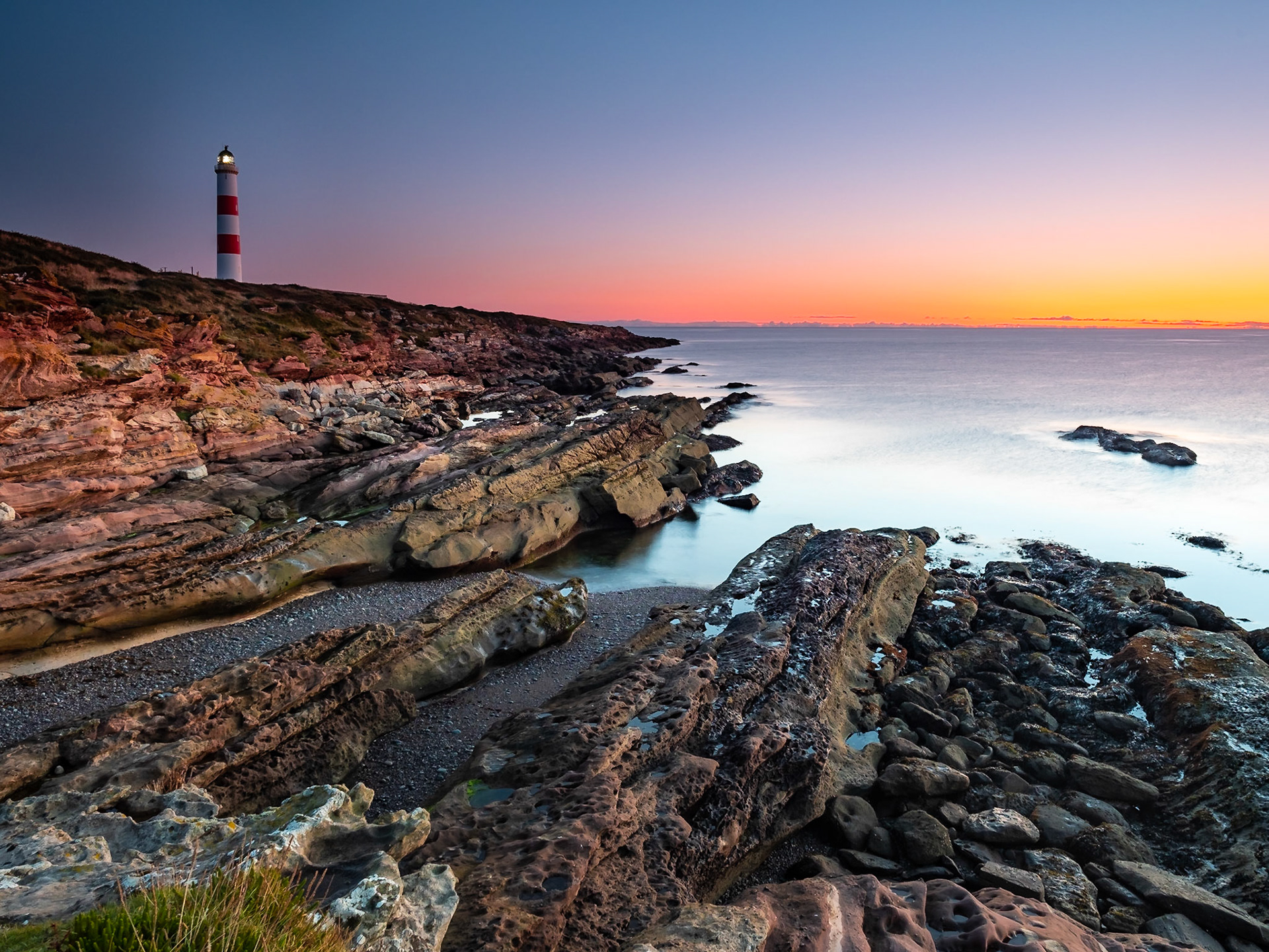 A cold early morning bathes the Tarbatness rocks in warm light