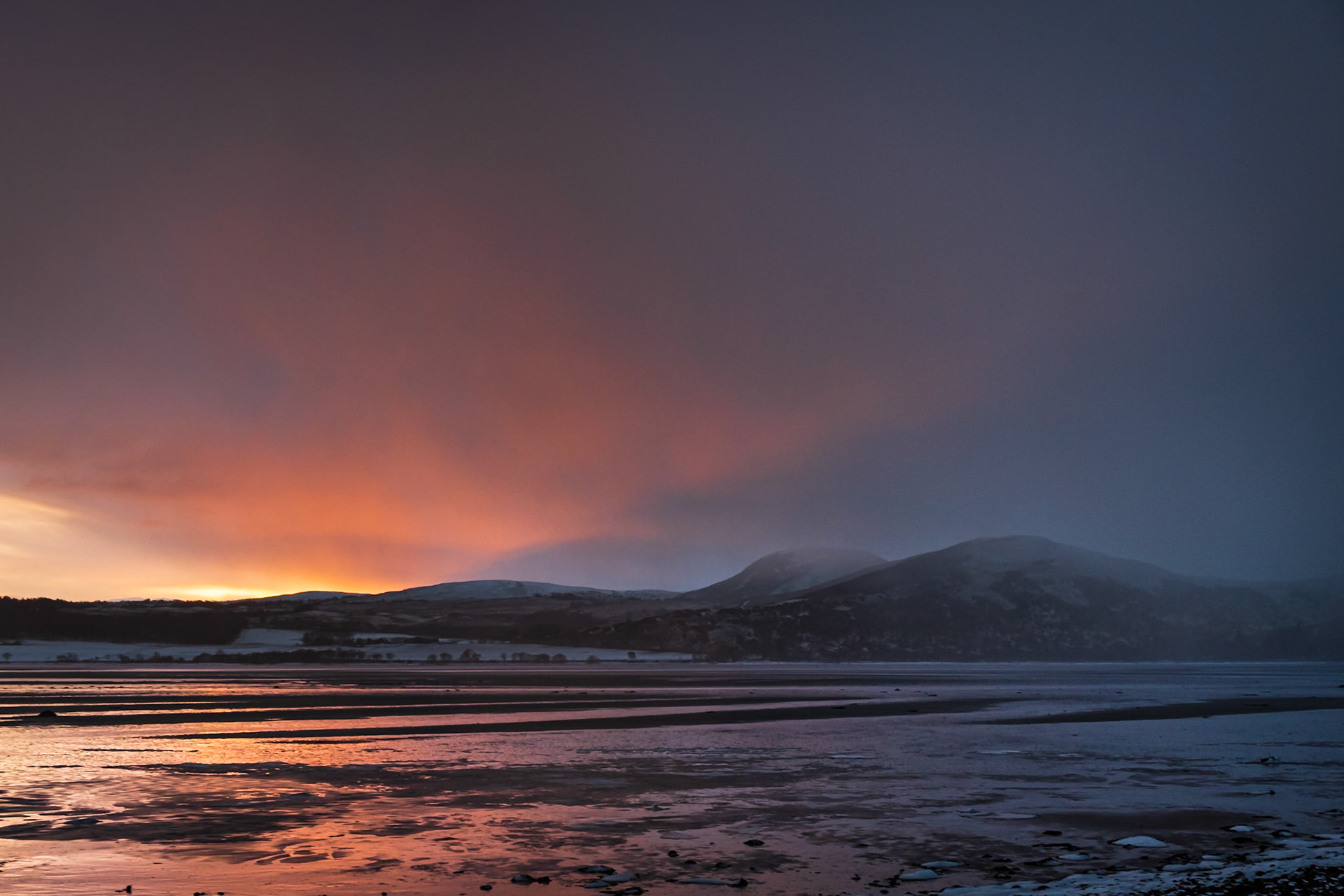 An incoming snow squall across Loch Fleet in Sutherland.