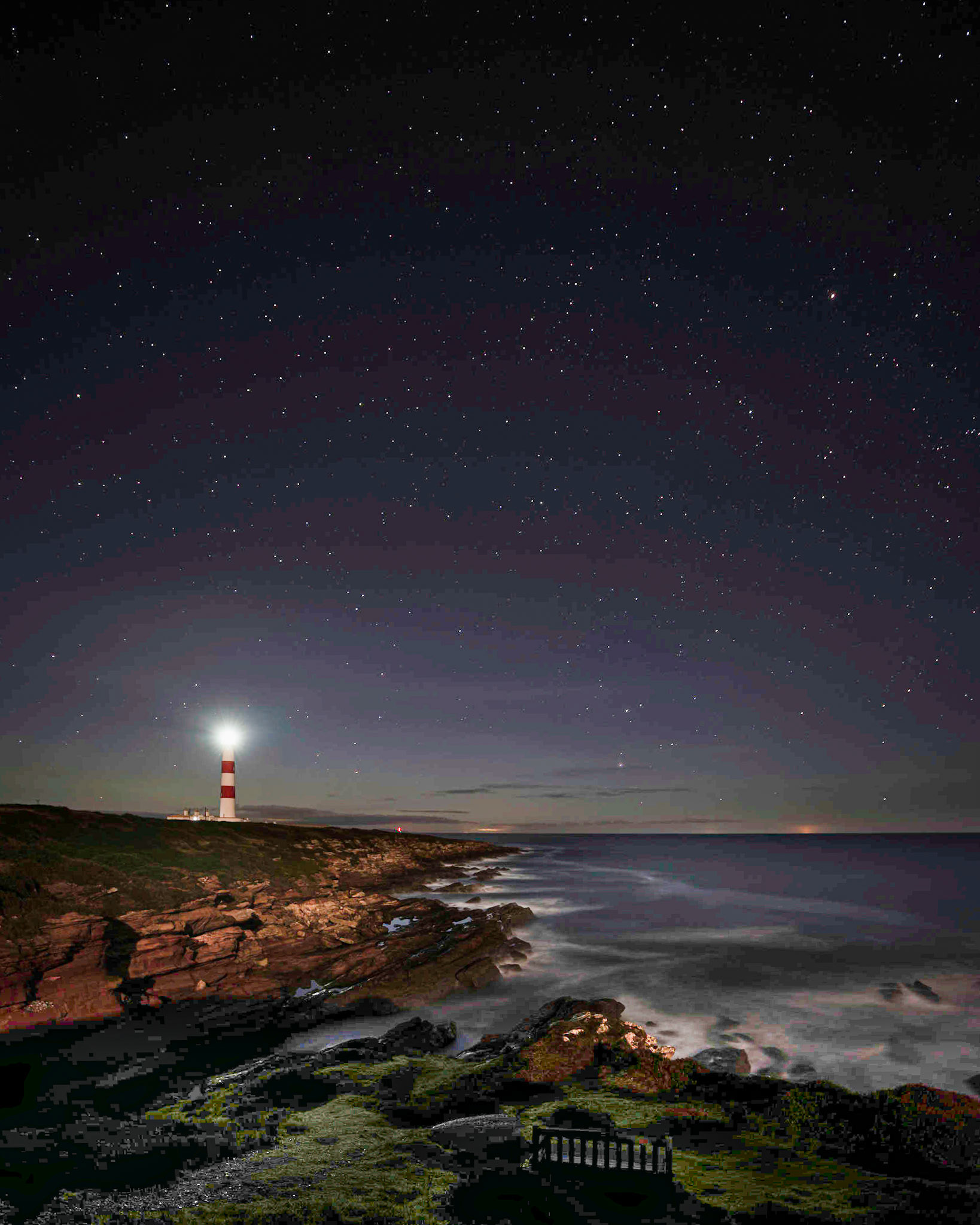 Looking to the north at Tarbatness, with the moon illuminating the sea as it breaks on the rocks below.