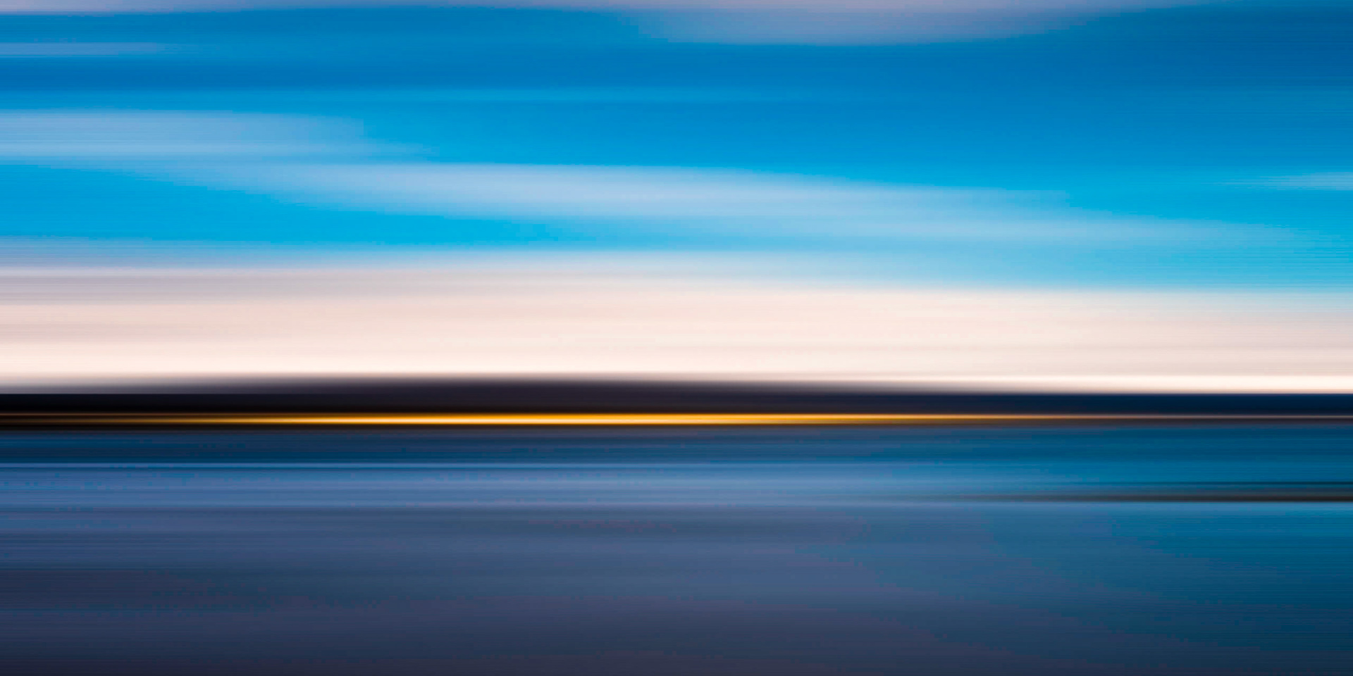 A moonlit night allows a long exposure which, together with some camera -drag, captures the essence of light over the Dornoch Firth.