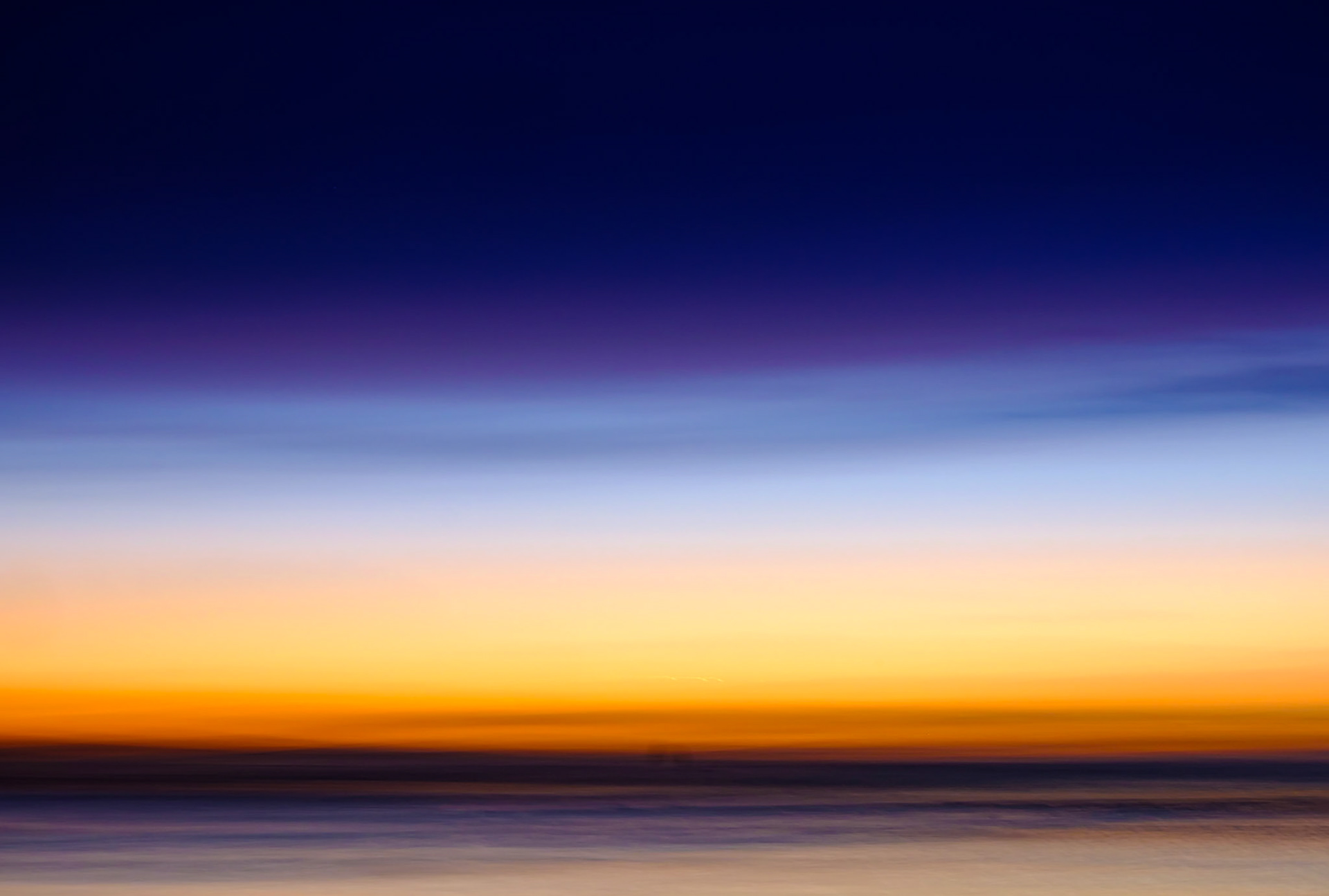 Once the sun goes down in high summer, the sky can take on a wonderful colour.  Deliberately moving the camera removes all reality, focussing only on those colours.