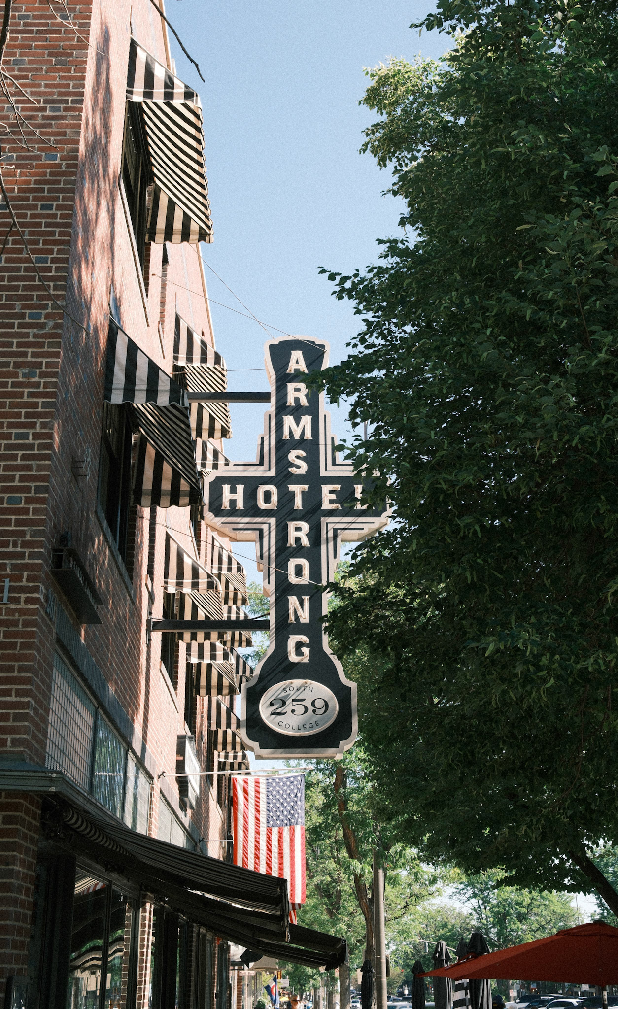 Captured on a photo walk around Old Town. Reggie's Portra recipe. I didn't even notice the repeating pattern of the awnings as I shot this - I was just trying to capture the sign and flag.